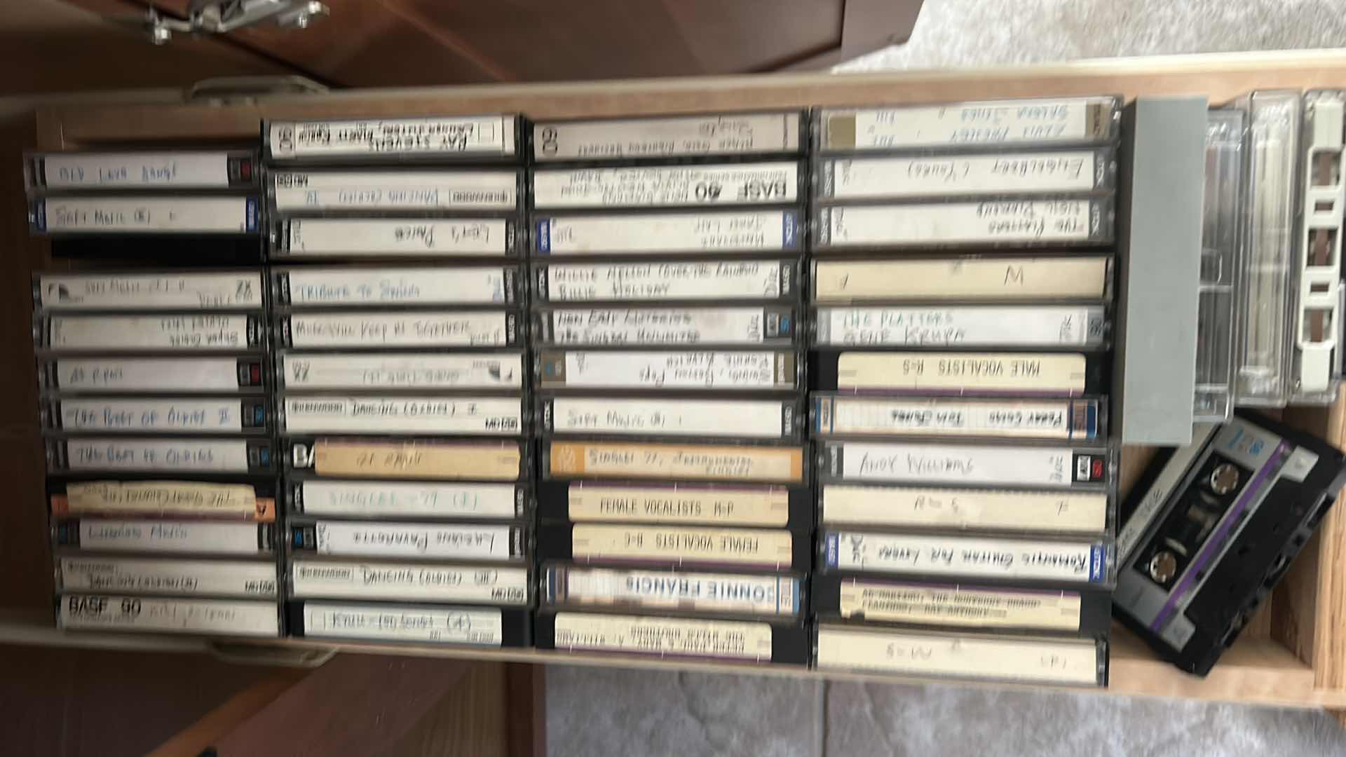 Photo 1 of 2 ROWS OF CASSETTE TAPES