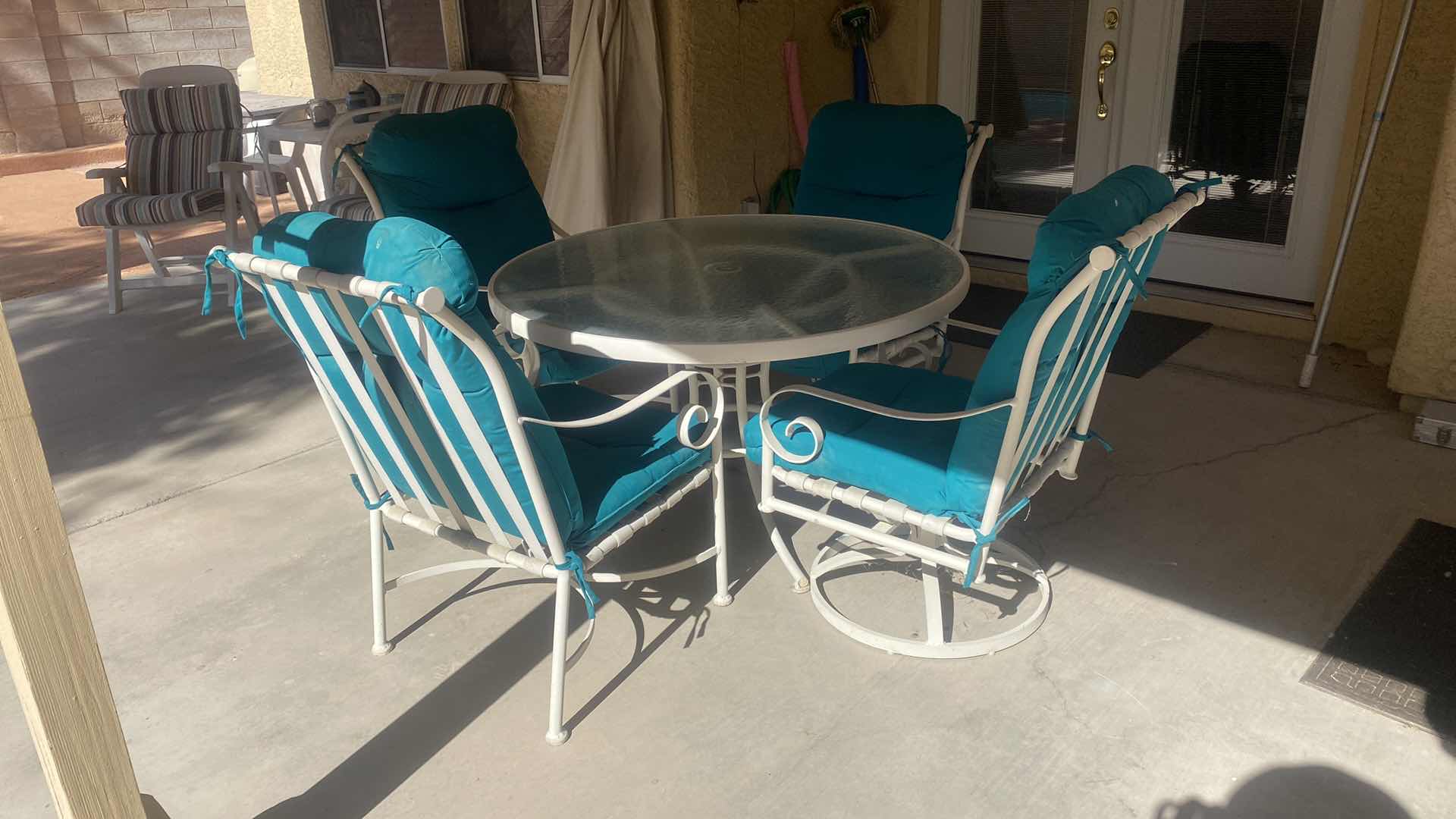 Photo 1 of 5 PIECE ALUMINUM GLASS TOP TABLE  48” x 28” AND 4 CHAIRS WITH CUSHIONS