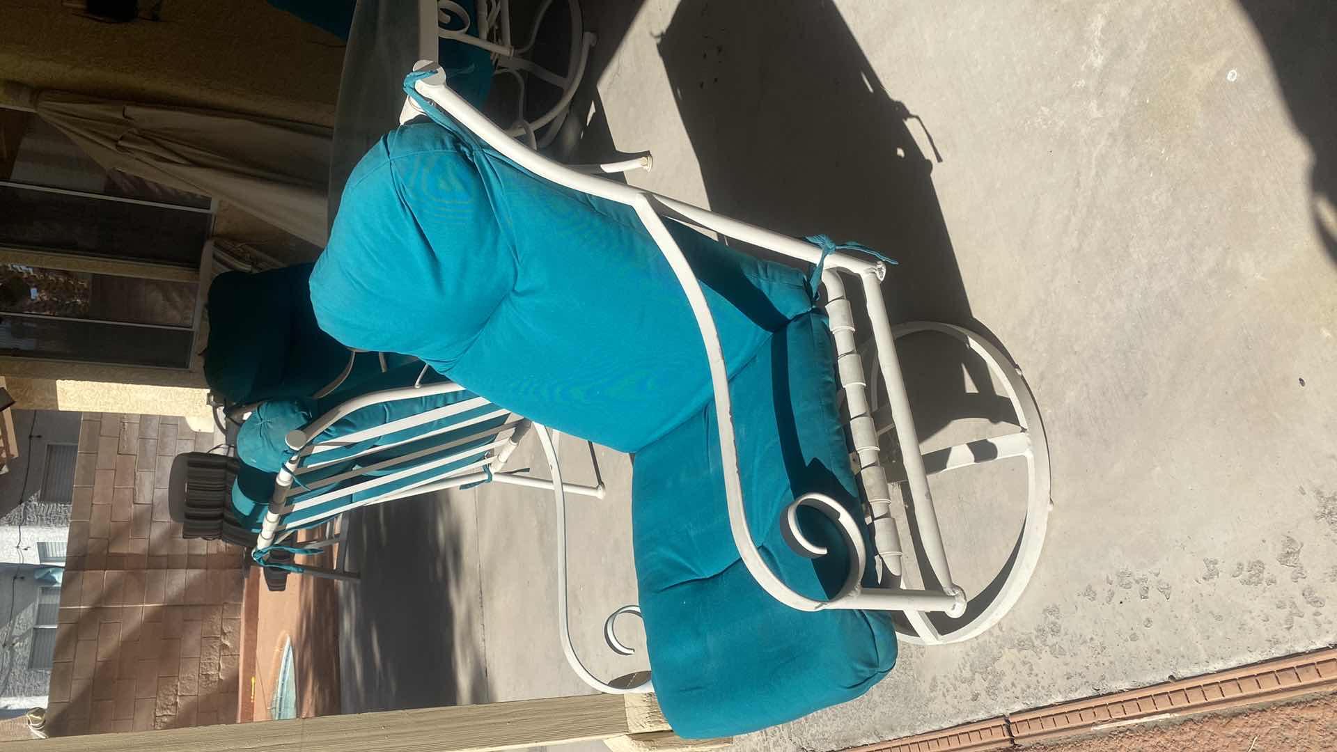 Photo 1 of 5 PIECE ALUMINUM GLASS TOP TABLE  48” x 28” AND 4 CHAIRS WITH CUSHIONS