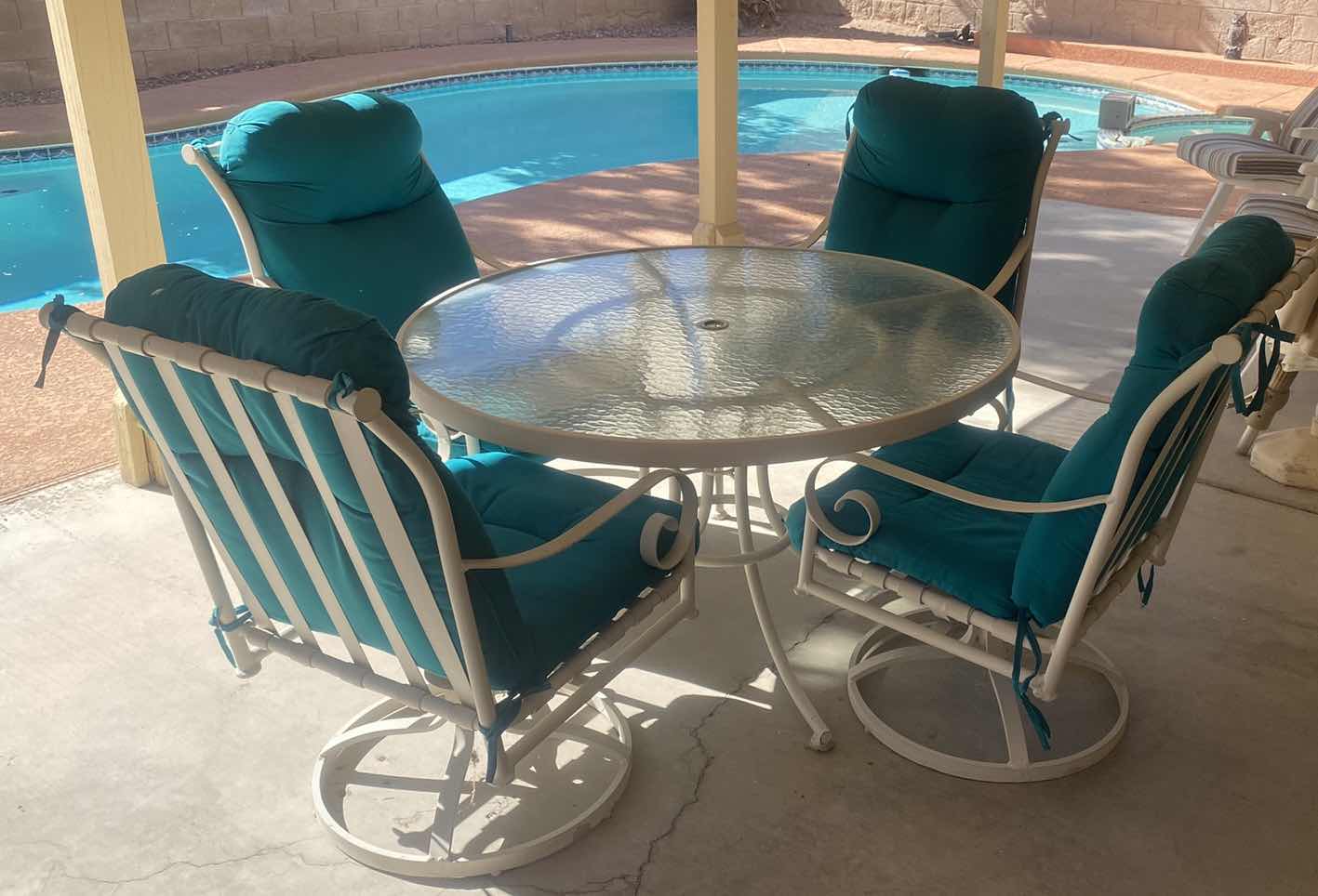 Photo 1 of 5 PIECE ALUMINUM GLASS TOP TABLE  48” x 28” AND 4 CHAIRS WITH CUSHIONS