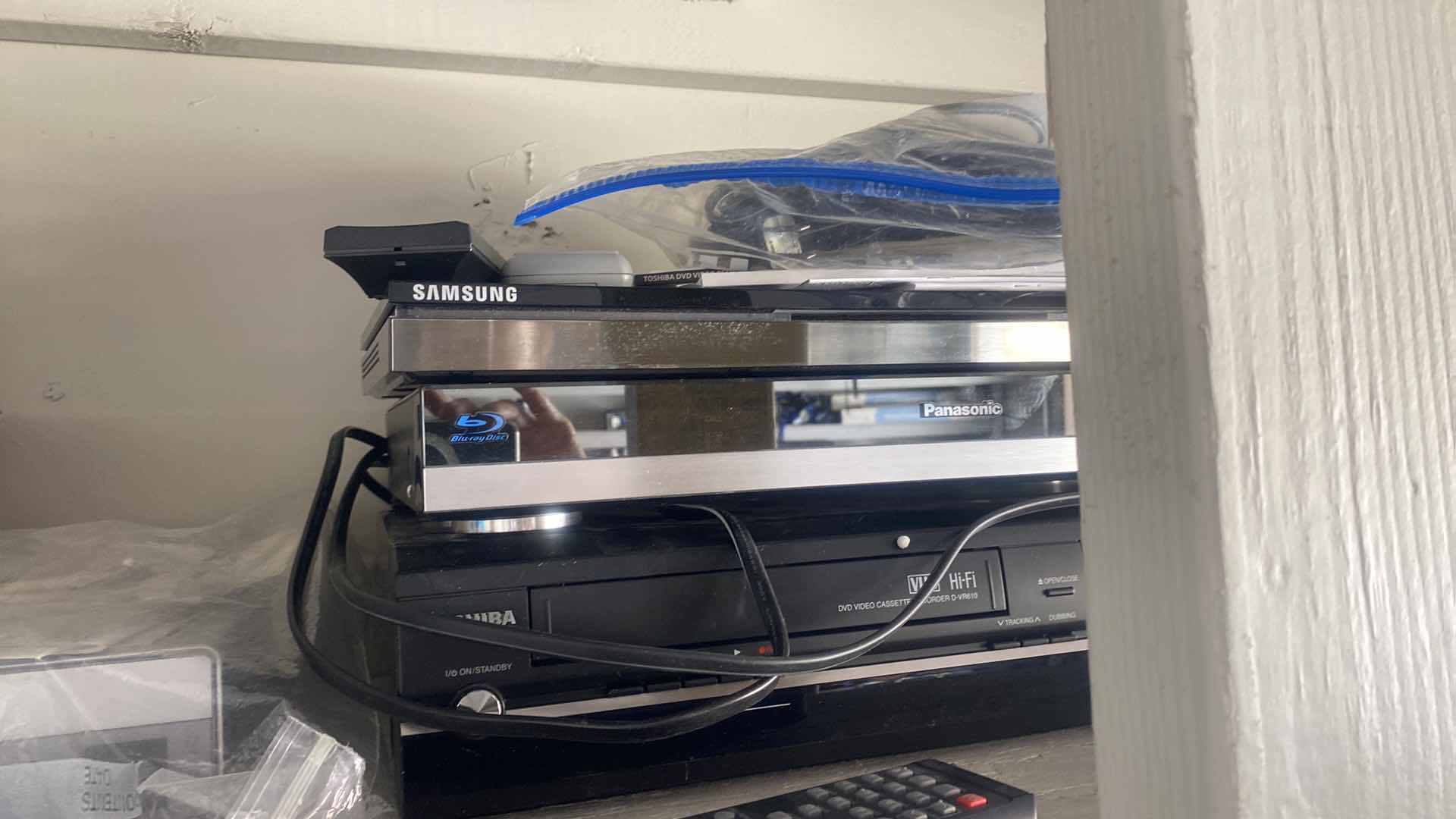 Photo 1 of GARAGE SHELF - ELECTRONICS ITEMS - UNKNOWN CONDITION