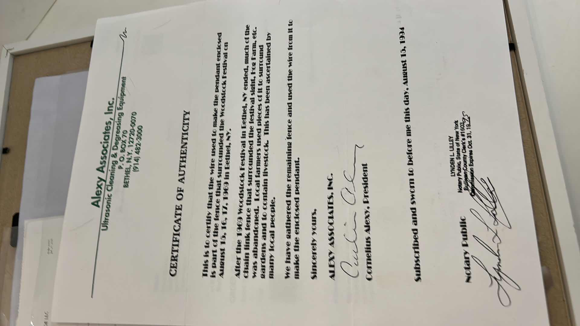 Photo 1 of AUTHENTIC WOODSTOCK FESTIVAL 1969 MEMORABILIA IN ORIGINAL DESIGNED SHADOW BOX. 12“ x 15“INCLUDES WOODSTOCK TICKET, PIECE OF THE GATE AND PIECE OF THE STAGE. GATE AND STAGE CRAFTED INTO PEACE SIGNS. DOCUMENTATION AND AUTHENTICITY PAPERS INCLUDED.