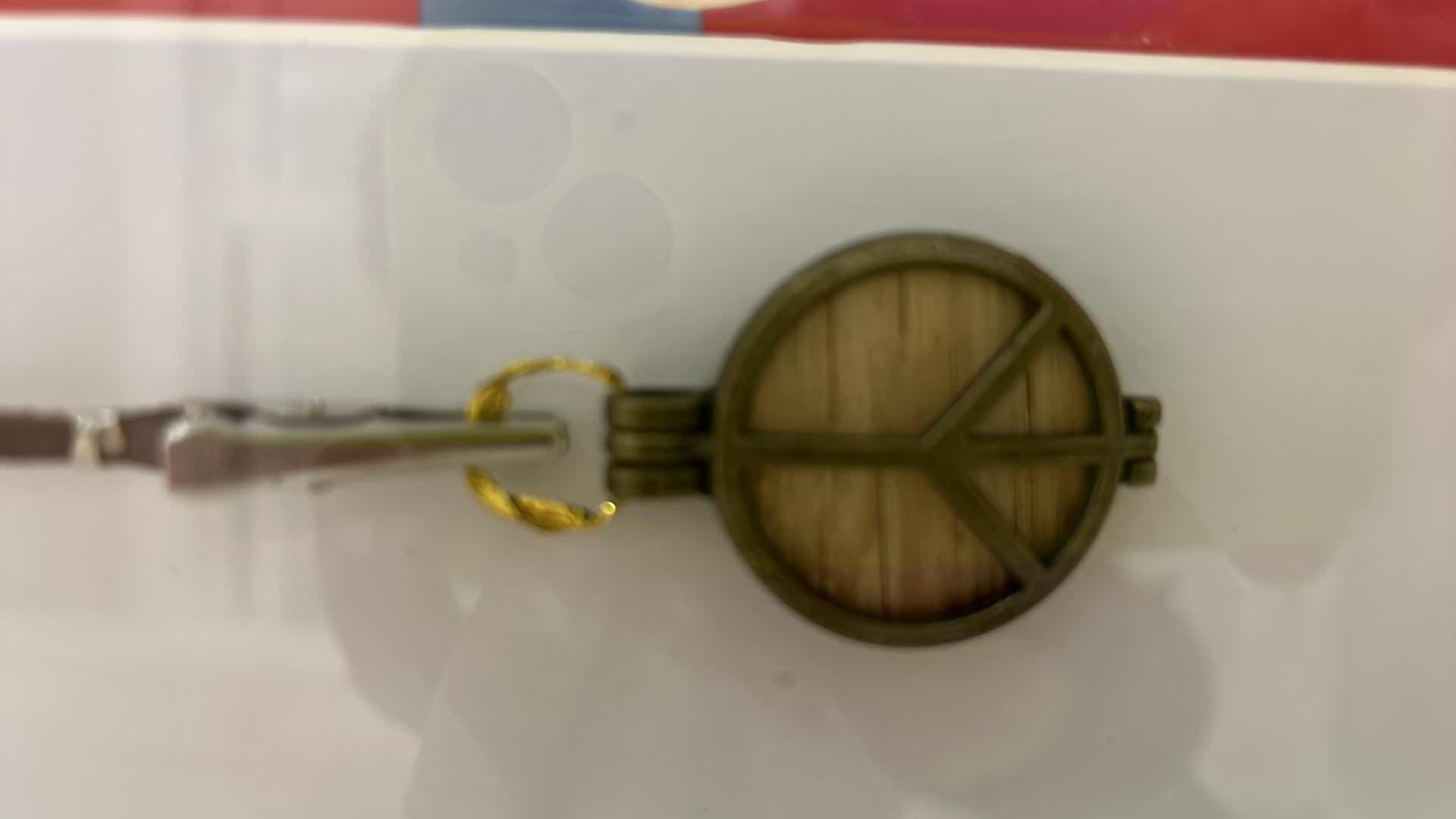 Photo 1 of AUTHENTIC WOODSTOCK FESTIVAL 1969 MEMORABILIA IN ORIGINAL DESIGNED SHADOW BOX. 12“ x 15“INCLUDES WOODSTOCK TICKET, PIECE OF THE GATE AND PIECE OF THE STAGE. GATE AND STAGE CRAFTED INTO PEACE SIGNS. DOCUMENTATION AND AUTHENTICITY PAPERS INCLUDED.