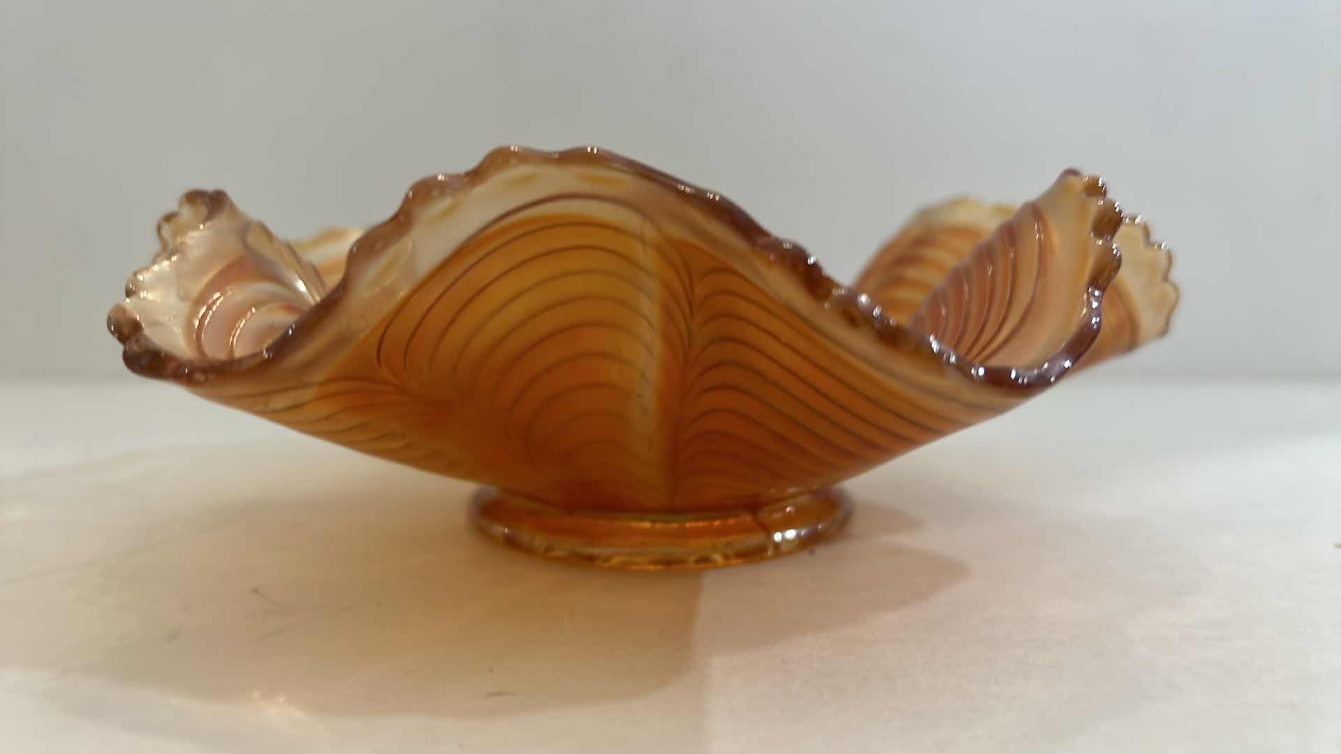 Photo 1 of VINTAGE CARNIVAL GLASS SCALLOPED BOWL 
7” x 2 1/4”