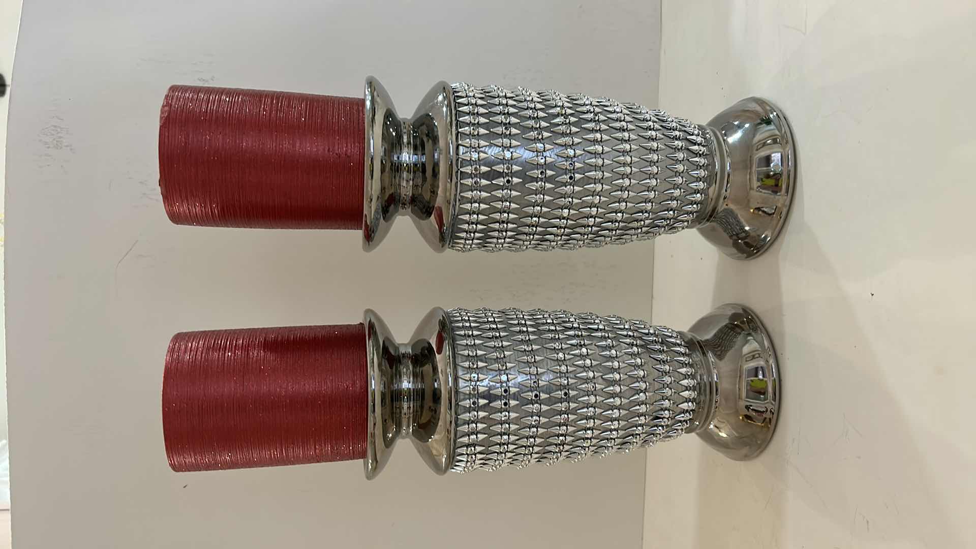 Photo 1 of 2 - 9.5” SPARKLY SILVER CANDLE HOLDERS AND 2 RED GLITTER CANDLES FROM Z GALLERI
