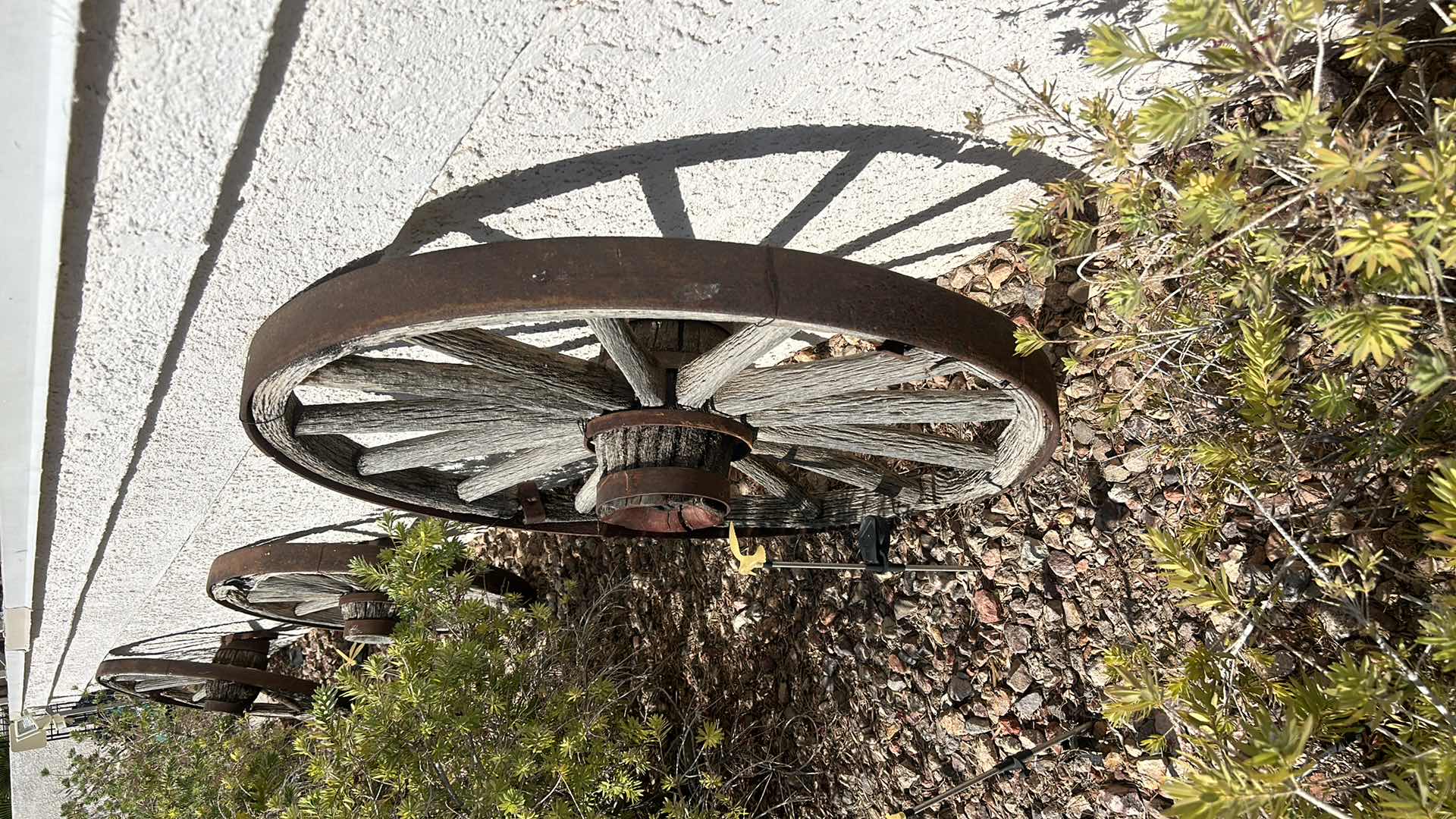 Photo 1 of ANTIQUE WOOD AND FORGED BRONZE WAGON WHEEL 42”