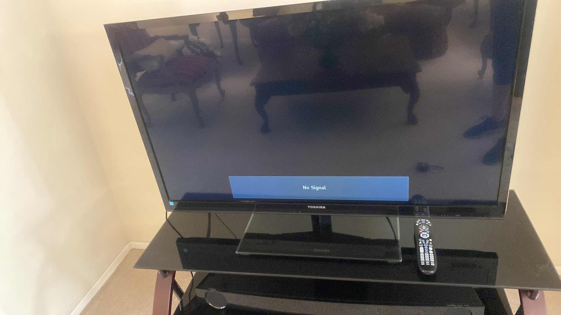 Photo 1 of TOSHIBA 46” TV WITH STAND AND YAMAHA SOUND BAR. INCLUDES COX REMOTE & TOSHIBA REMOTE STAND MEASURES 48” x 18” x 21 1/2”