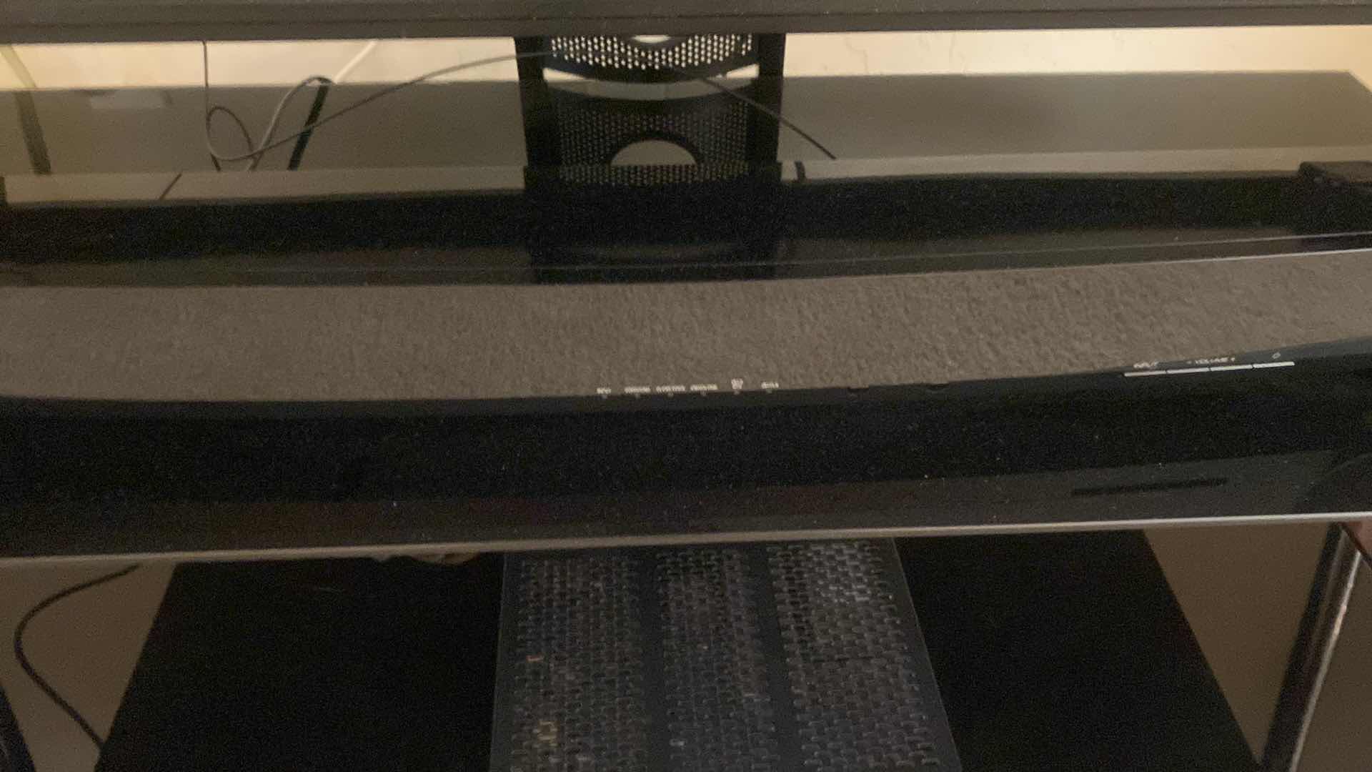 Photo 1 of TOSHIBA 46” TV WITH STAND AND YAMAHA SOUND BAR. INCLUDES COX REMOTE & TOSHIBA REMOTE STAND MEASURES 48” x 18” x 21 1/2”