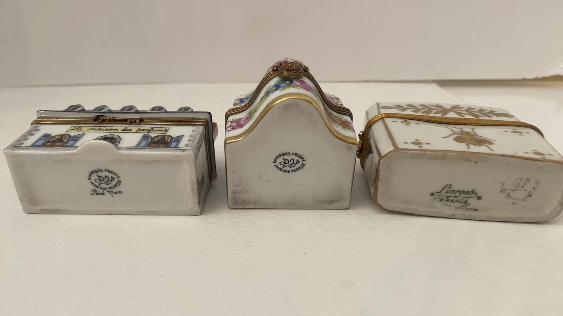 Photo 1 of LIMOGES WITH PERFUME BOTTLES LARGEST 3“ x 2 3/4”