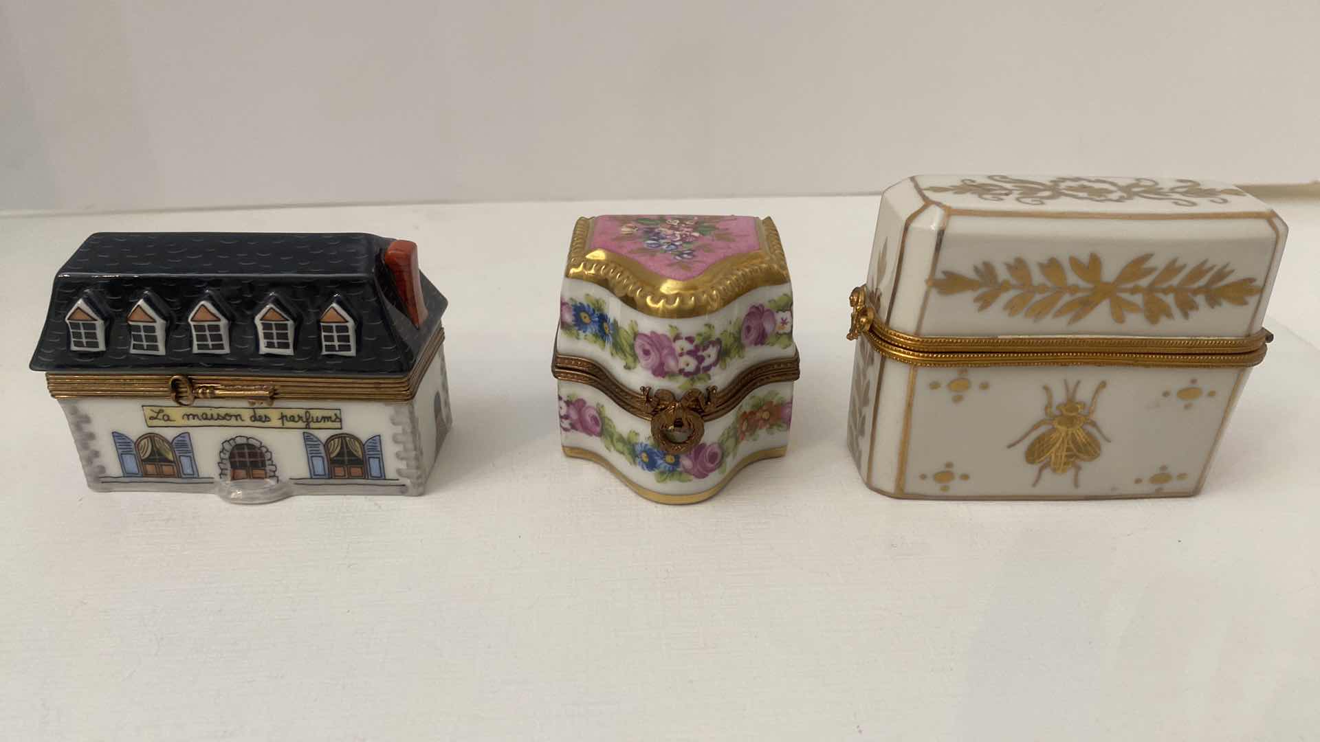 Photo 1 of LIMOGES WITH PERFUME BOTTLES LARGEST 3“ x 2 3/4”