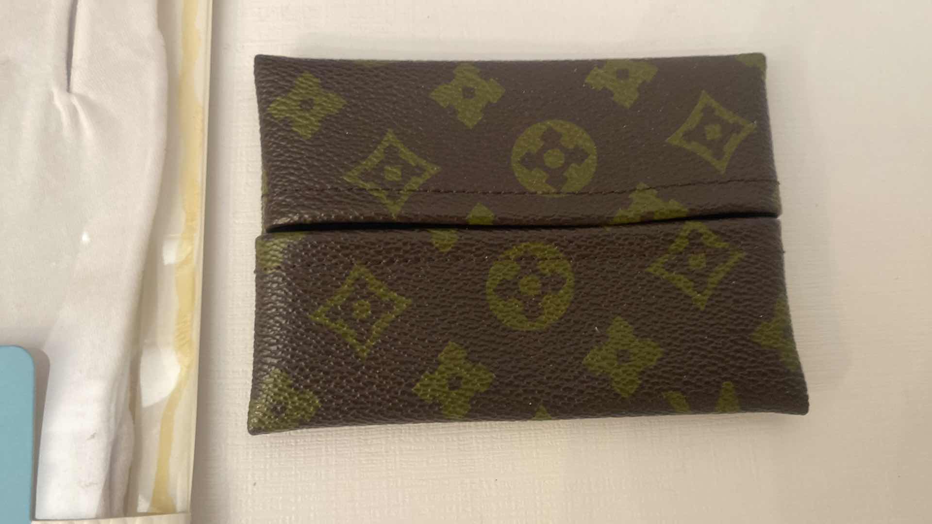 Photo 1 of LOUIS VUITTON UNAUTHENTICATED POCKET KLEENEX HOLDER & WOMENS CARE ASSORTMENT