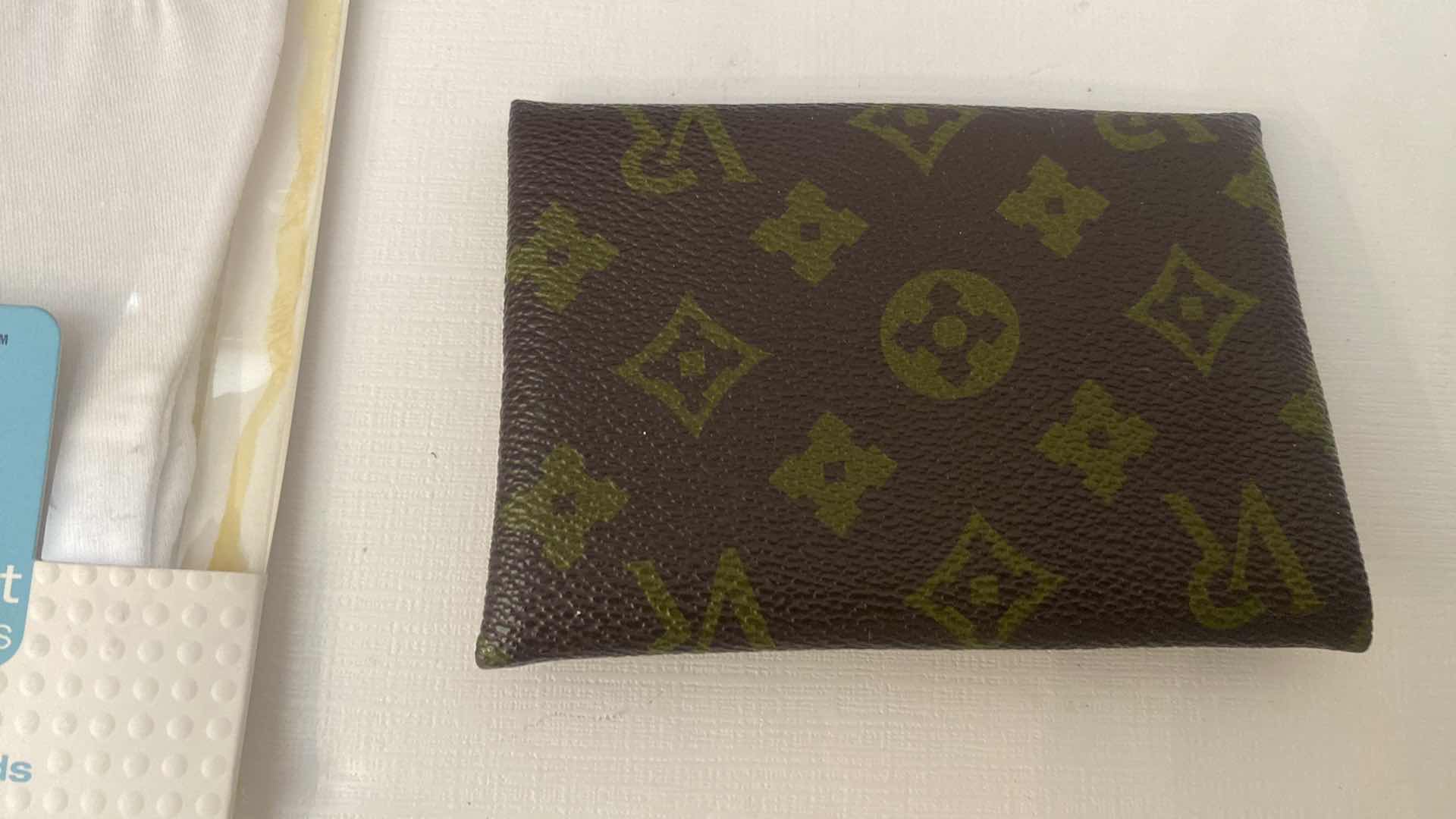 Photo 1 of LOUIS VUITTON UNAUTHENTICATED POCKET KLEENEX HOLDER & WOMENS CARE ASSORTMENT