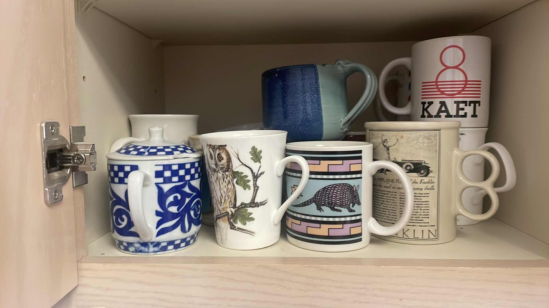 Photo 1 of CONTENTS OF KITCHEN CABINET - COFFEE CUPS  MUGS & GLASSES