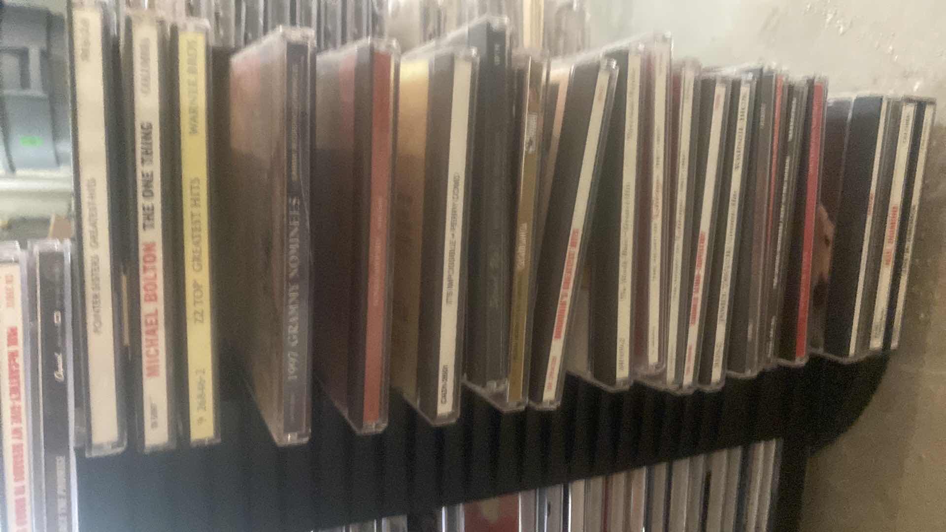 Photo 1 of CD’s ON STORAGE RACK