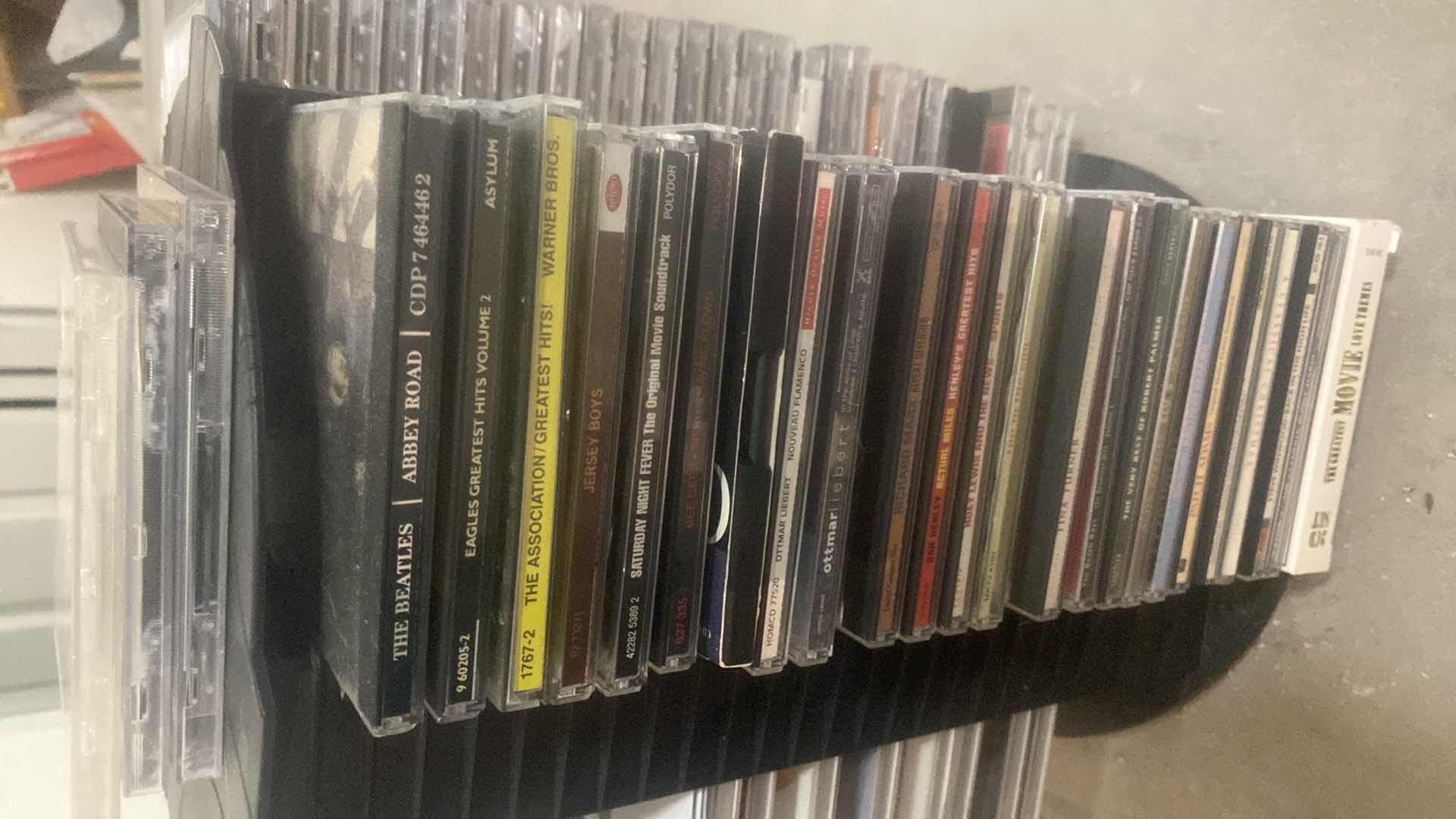 Photo 1 of CD’s ON STORAGE RACK