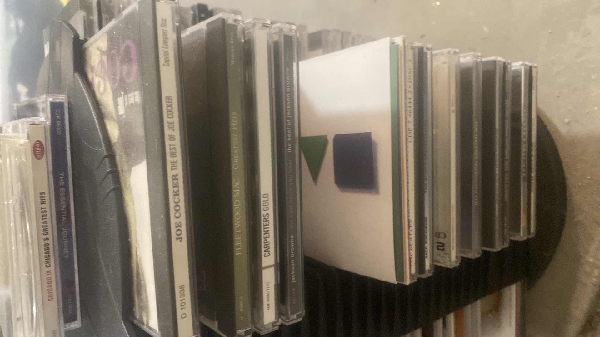 Photo 1 of CD’s ON STORAGE RACK