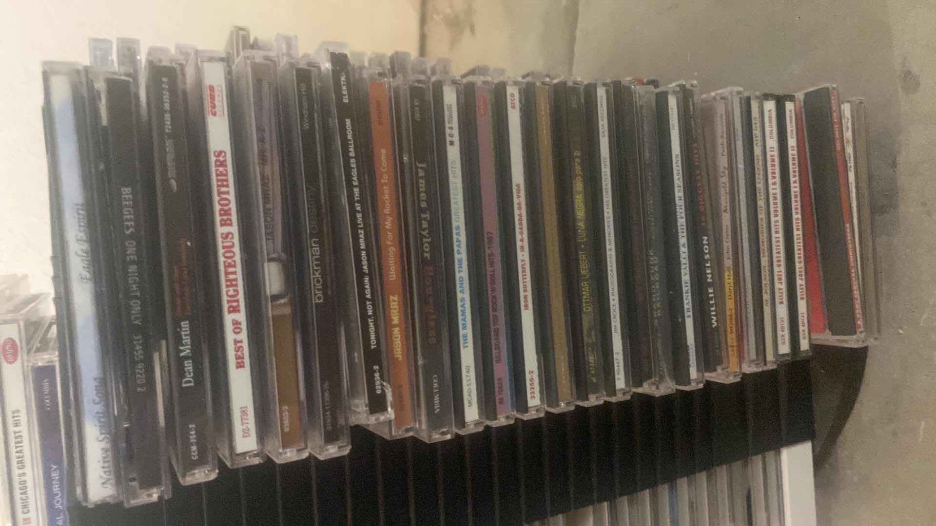 Photo 1 of CD’s ON STORAGE RACK