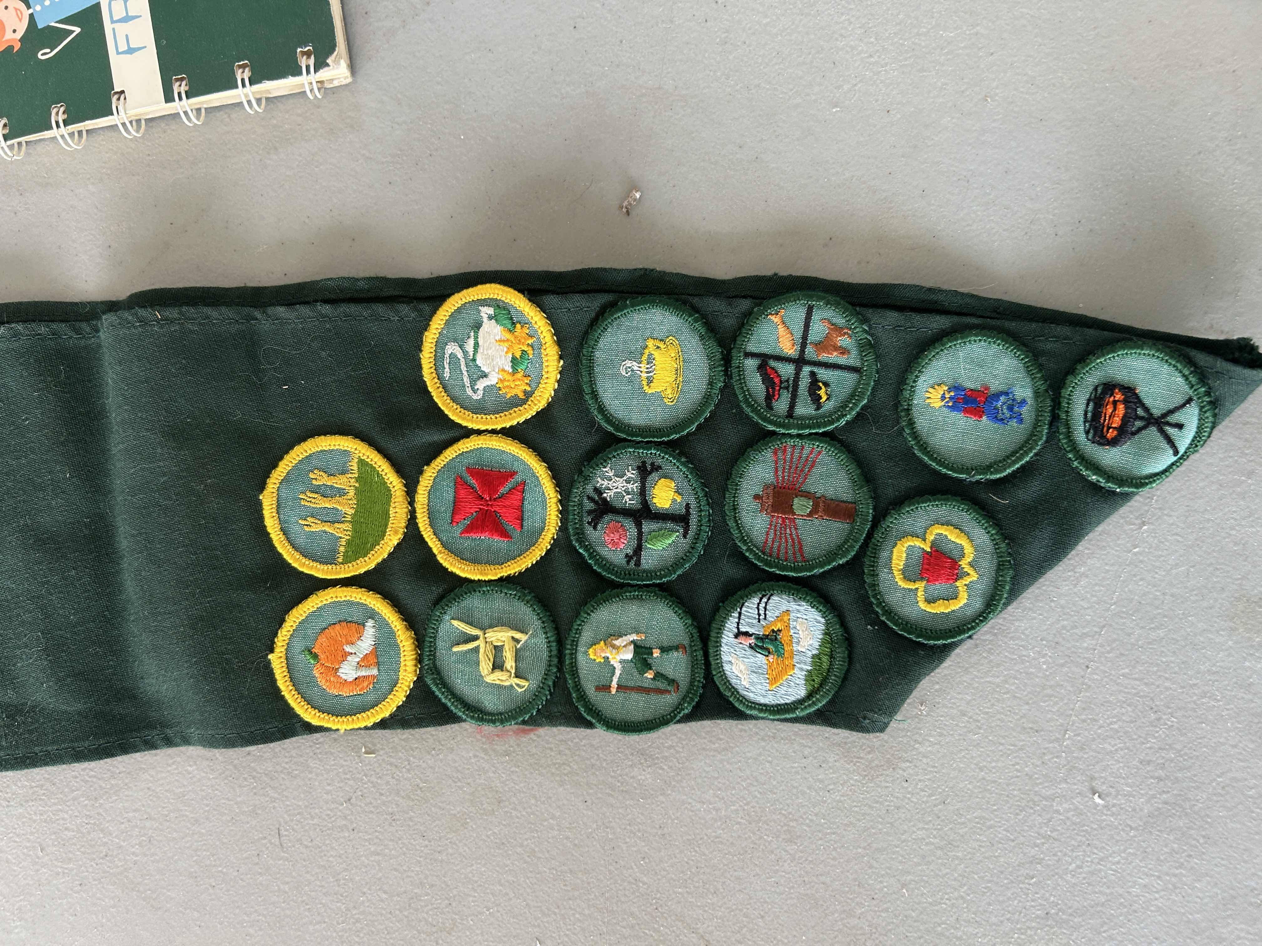 Photo 1 of VINTAGE GIRLSCOUT SASH, BADGES AND BOOK
