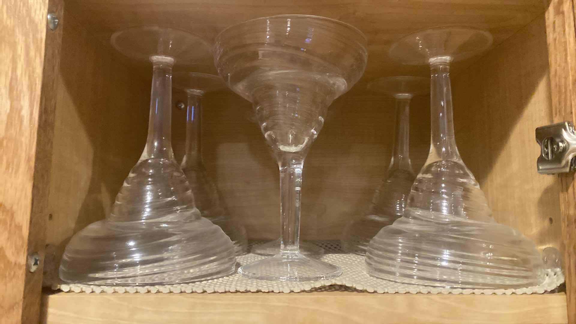 Photo 1 of CONTENTS OF 2 SHELVES KITCHEN CABINET- PLASTIC MARGUERITA GLASSES & PLATTERS