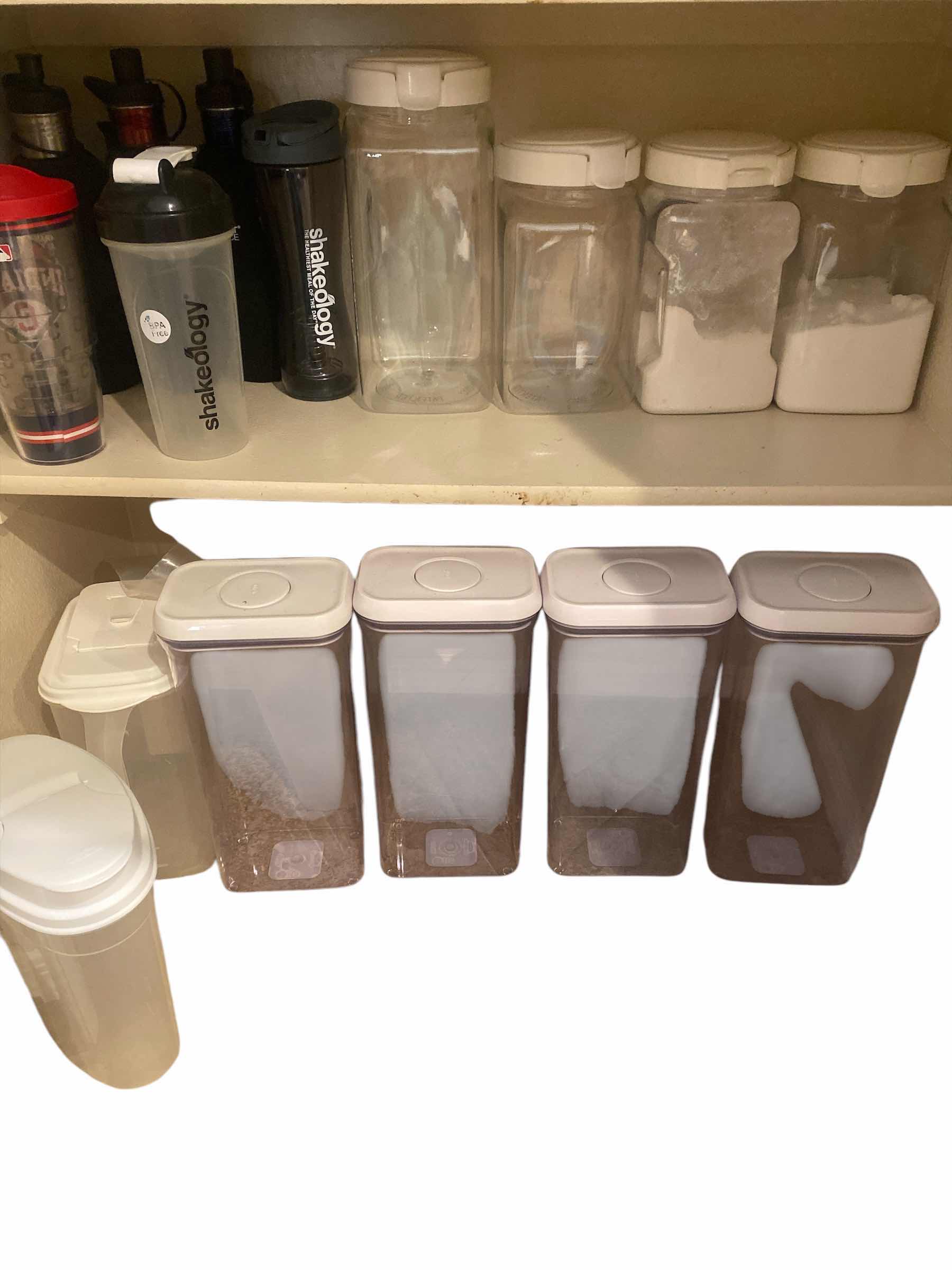 Photo 1 of 2 - BOTTOM SHELFS PANTRY - STORAGE PLASTICS & CUPS