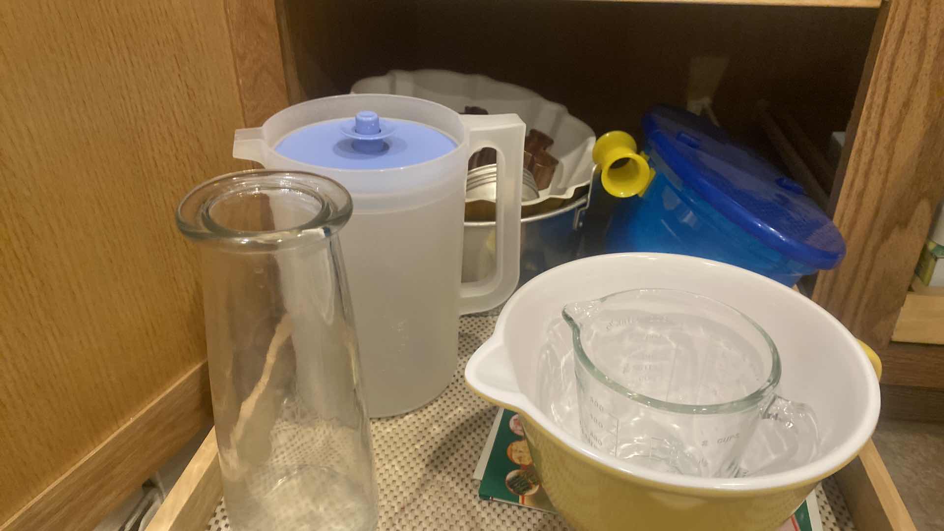 Photo 1 of CONTENTS KITCHEN CABINET - BUNDT & ANGEL FOOD PANS & PLASTIC WARE