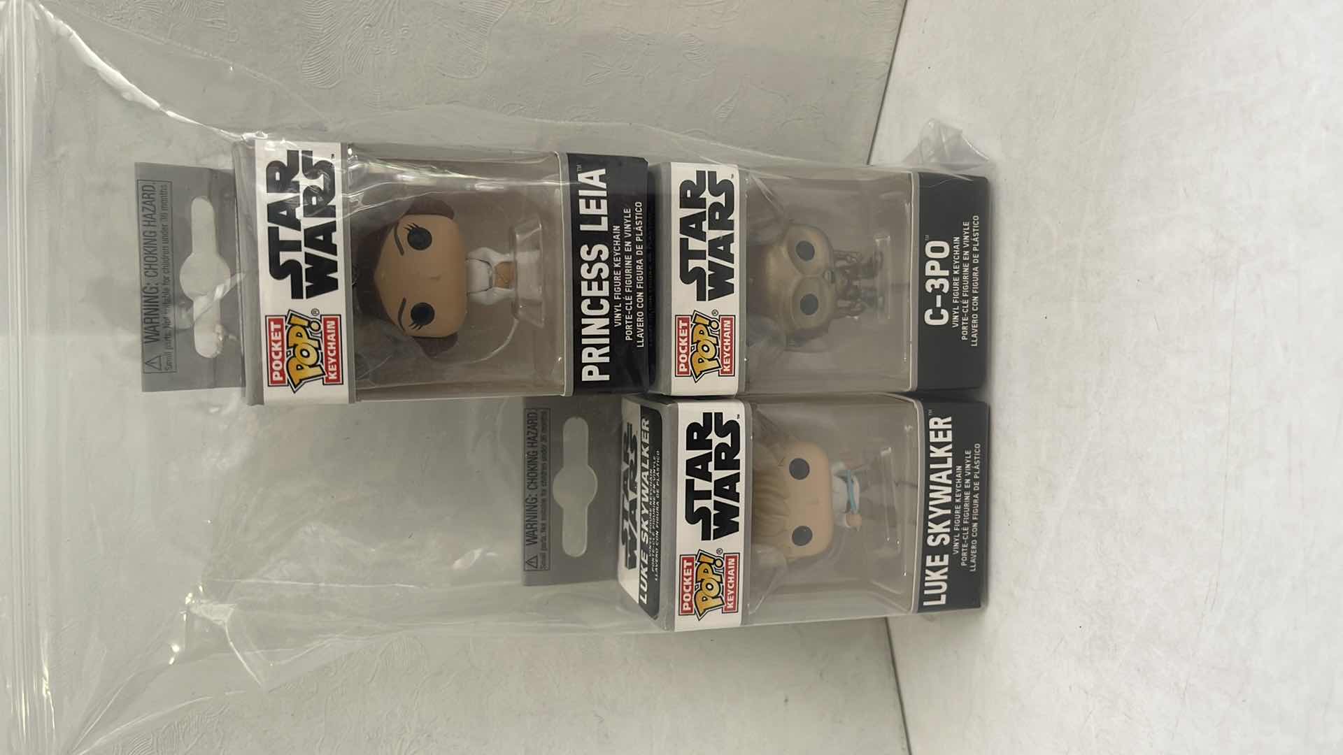 Photo 1 of NIB FUNKO POP POCKET KEYCHAIN STAR WARS DIFFERENT SET OF (3)