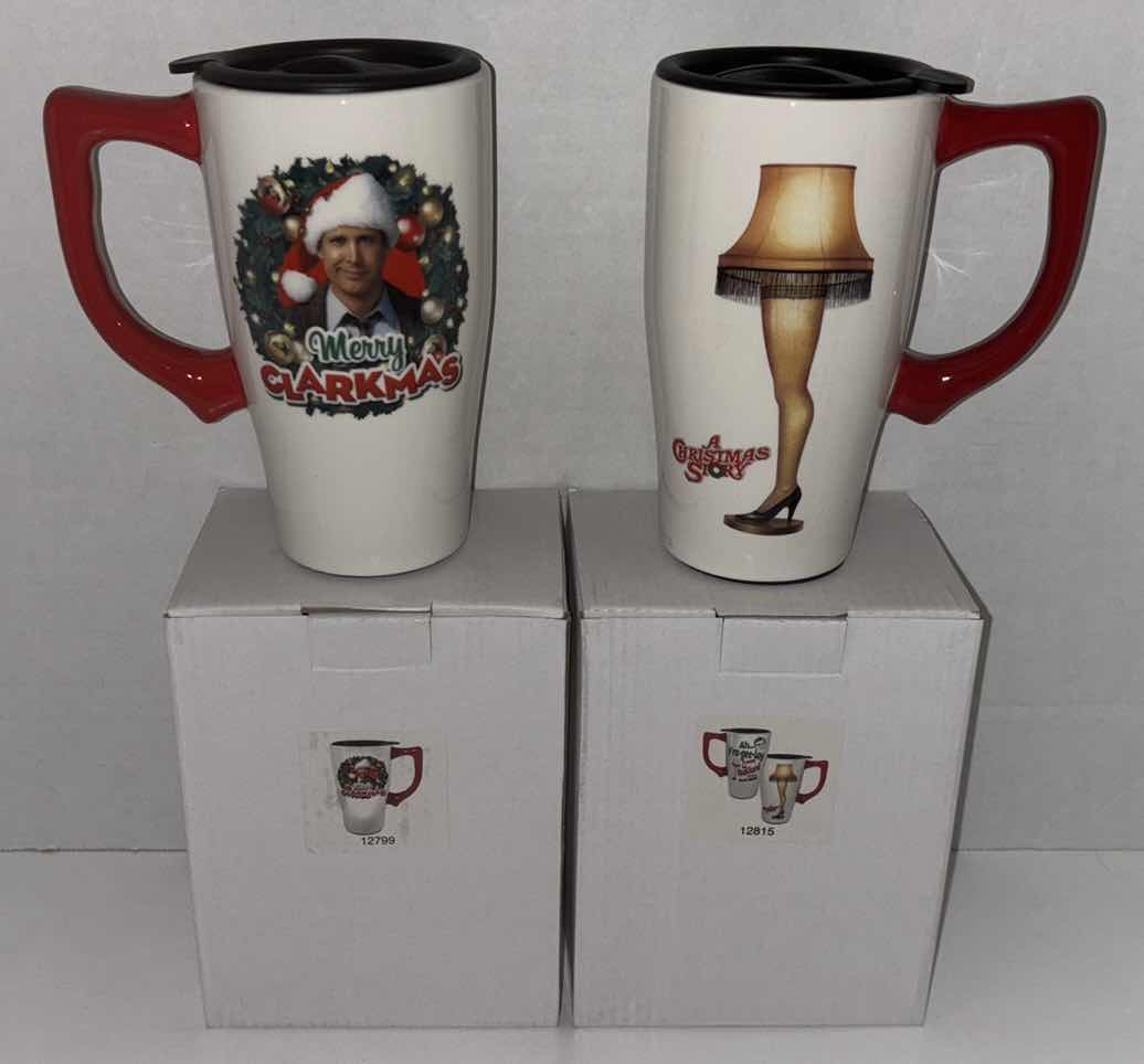 Photo 1 of NEW 2-PACK SPOONIQUES 18 OZ CHRISTMAS THEME CERAMIC TRAVEL MUG W/HANDLE, “MERRY CLARKMAS” & “A CHRISTMAS STORY LEG LAMP”