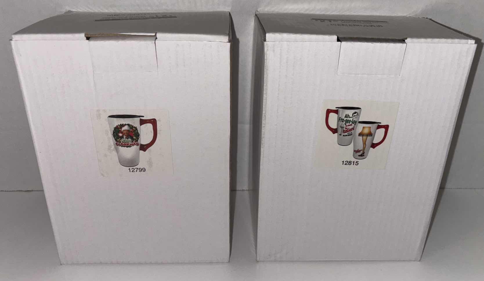 Photo 1 of NEW 2-PACK SPOONIQUES 18 OZ CHRISTMAS THEME CERAMIC TRAVEL MUG W/HANDLE, “MERRY CLARKMAS” & “A CHRISTMAS STORY LEG LAMP”