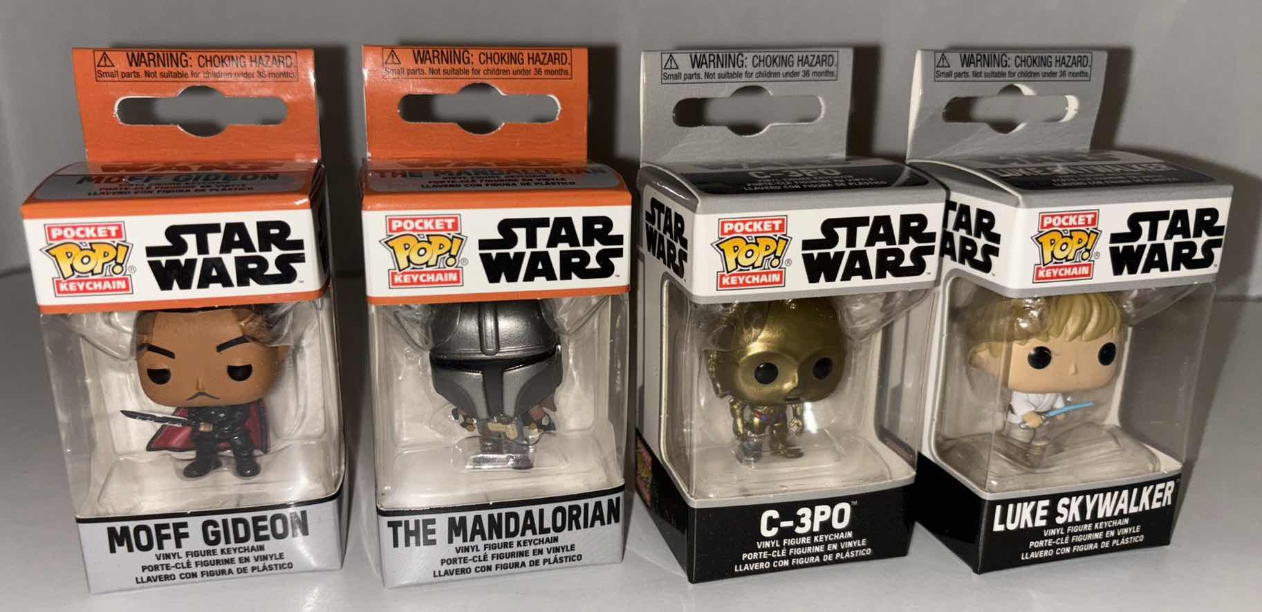 Photo 1 of NEW 12-PACK FUNKO POP!
STAR WARS POCKET POP VINYL FIGURE KEYCHAIN “MOFF GIDEON”, “THE MANDALORIAN”, “C-3PO”, “LUKE SKYWALKER” (3 EACH)