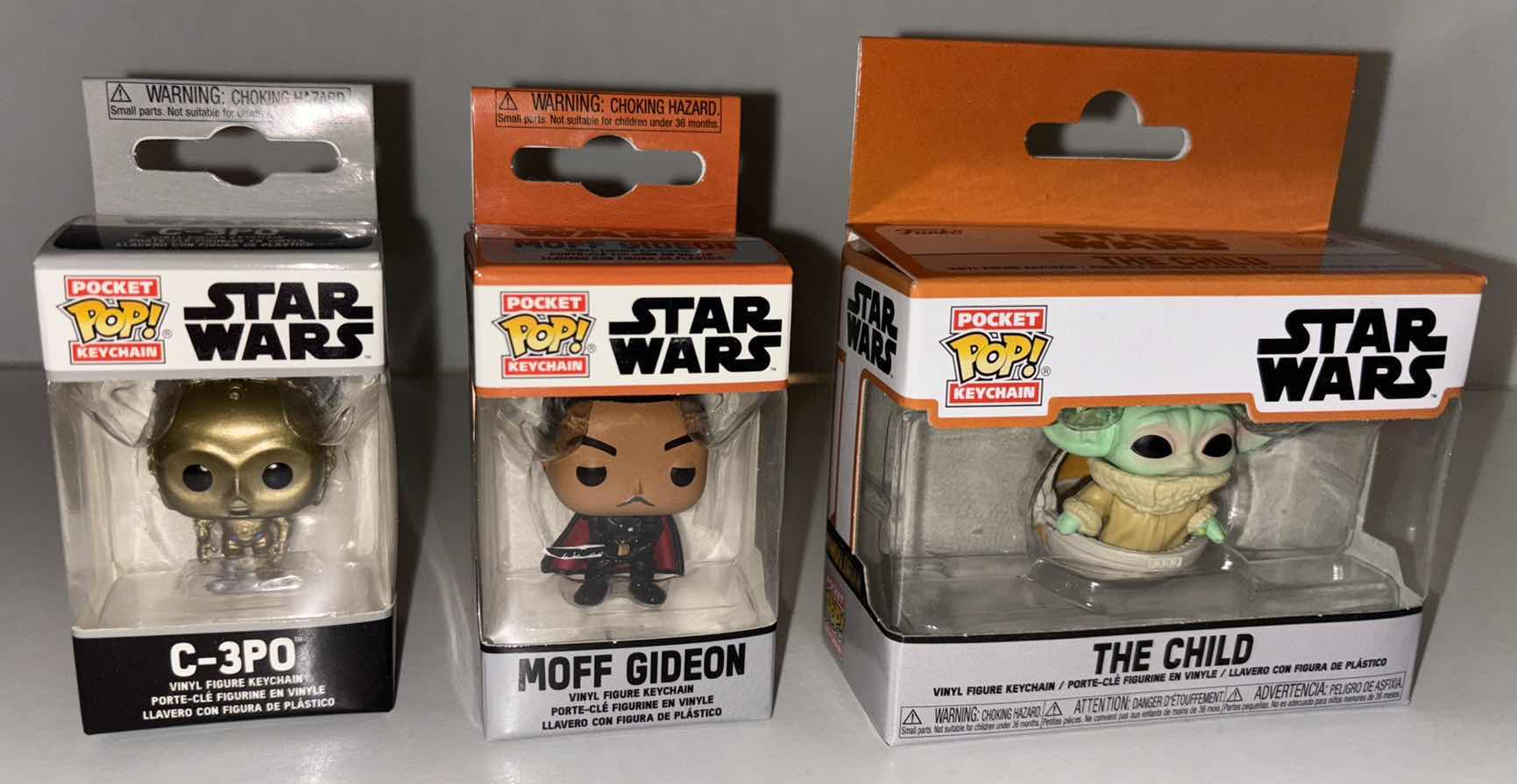 Photo 1 of NEW 9-PACK FUNKO POP!
STAR WARS POCKET POP VINYL FIGURE KEYCHAIN, “C-3PO” (5), “MOFF GIDEON” (2) & “THE CHILD” (2)