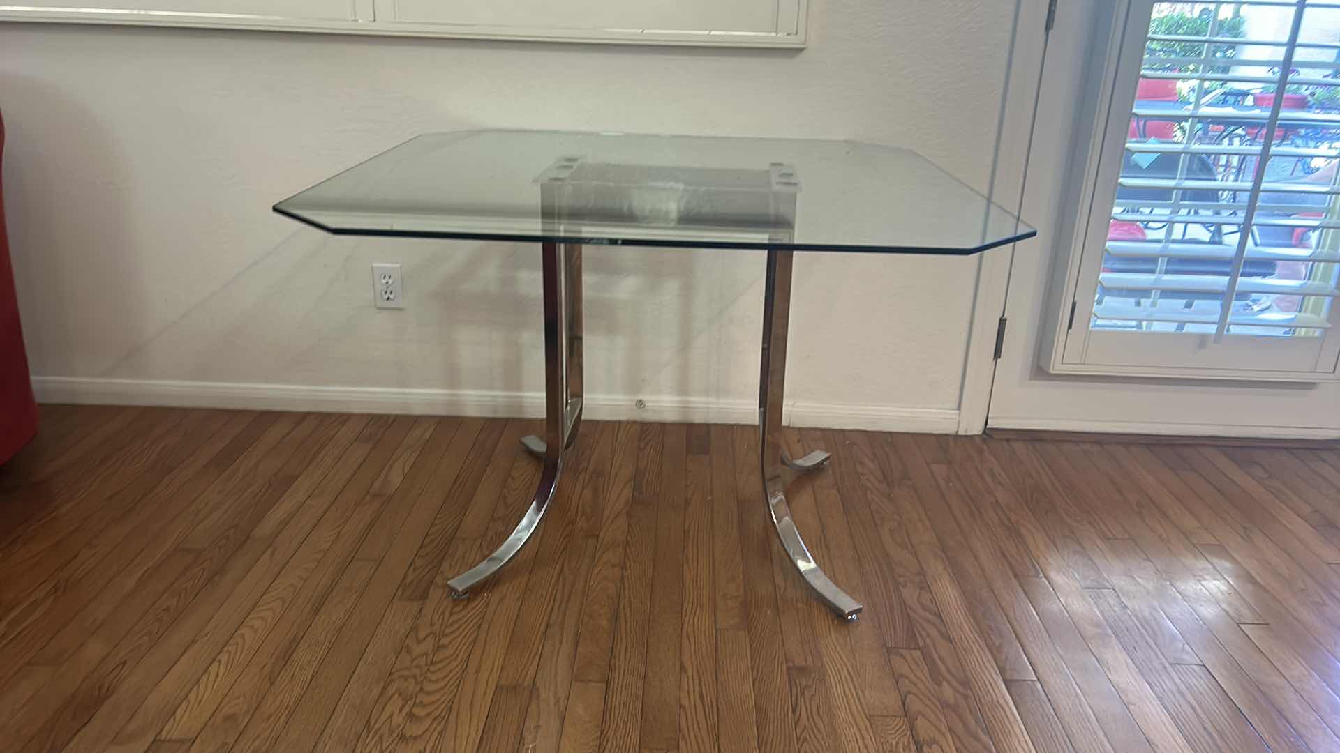 Photo 1 of CHROME AND GLASS DINING ROOM TABLE 42” x 42” x 28 1/2”