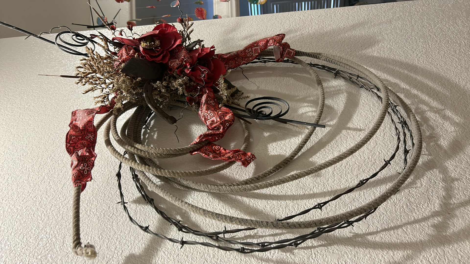 Photo 1 of BARBWIRE AND LASSO WREATH 36” x 28”
