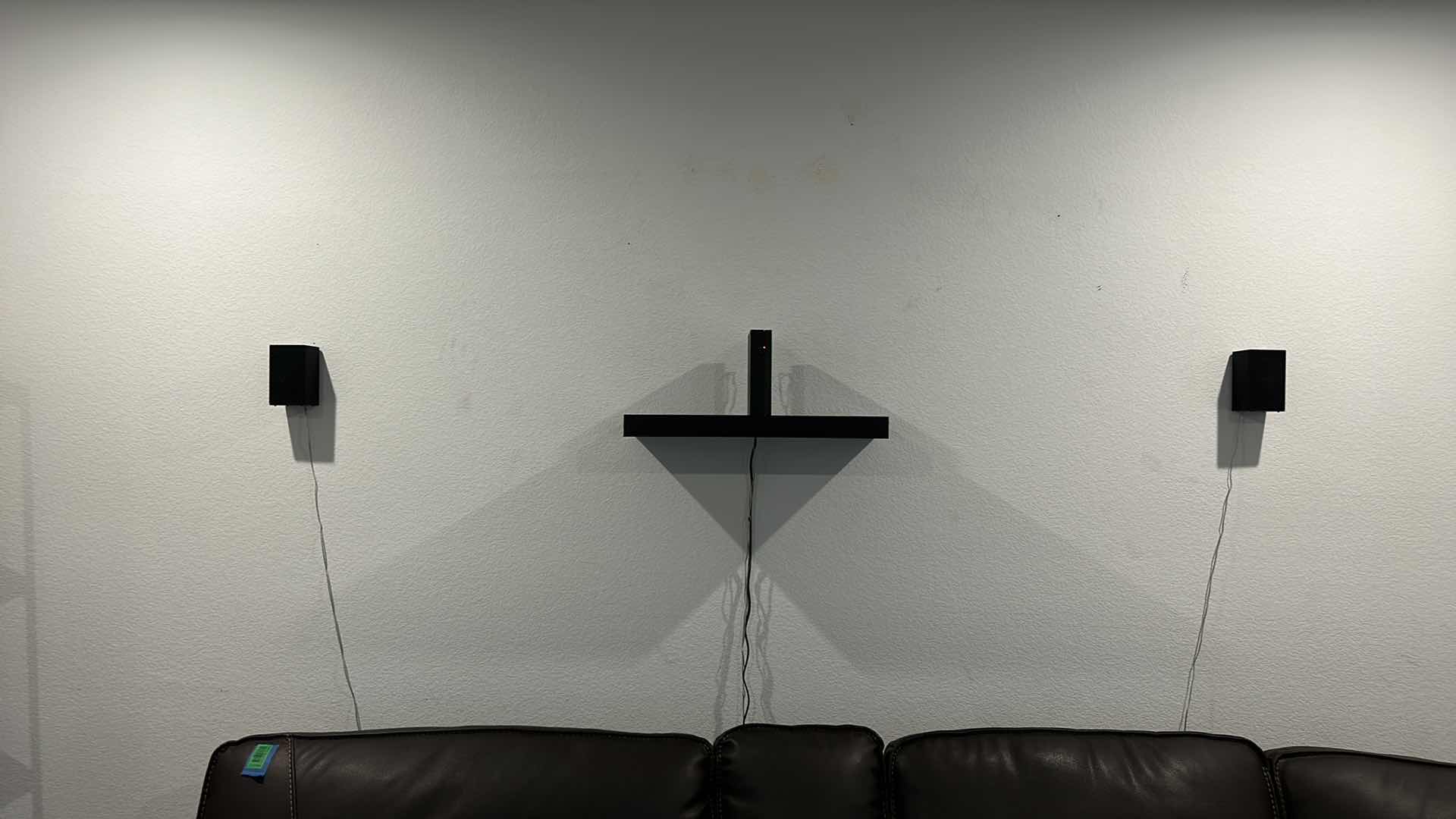 Photo 1 of BLACK FLOATING SHELF AND SURROUND SOUND 3 SPEAKERS (2 WALL MOUNTED AND 1 FLOOR)