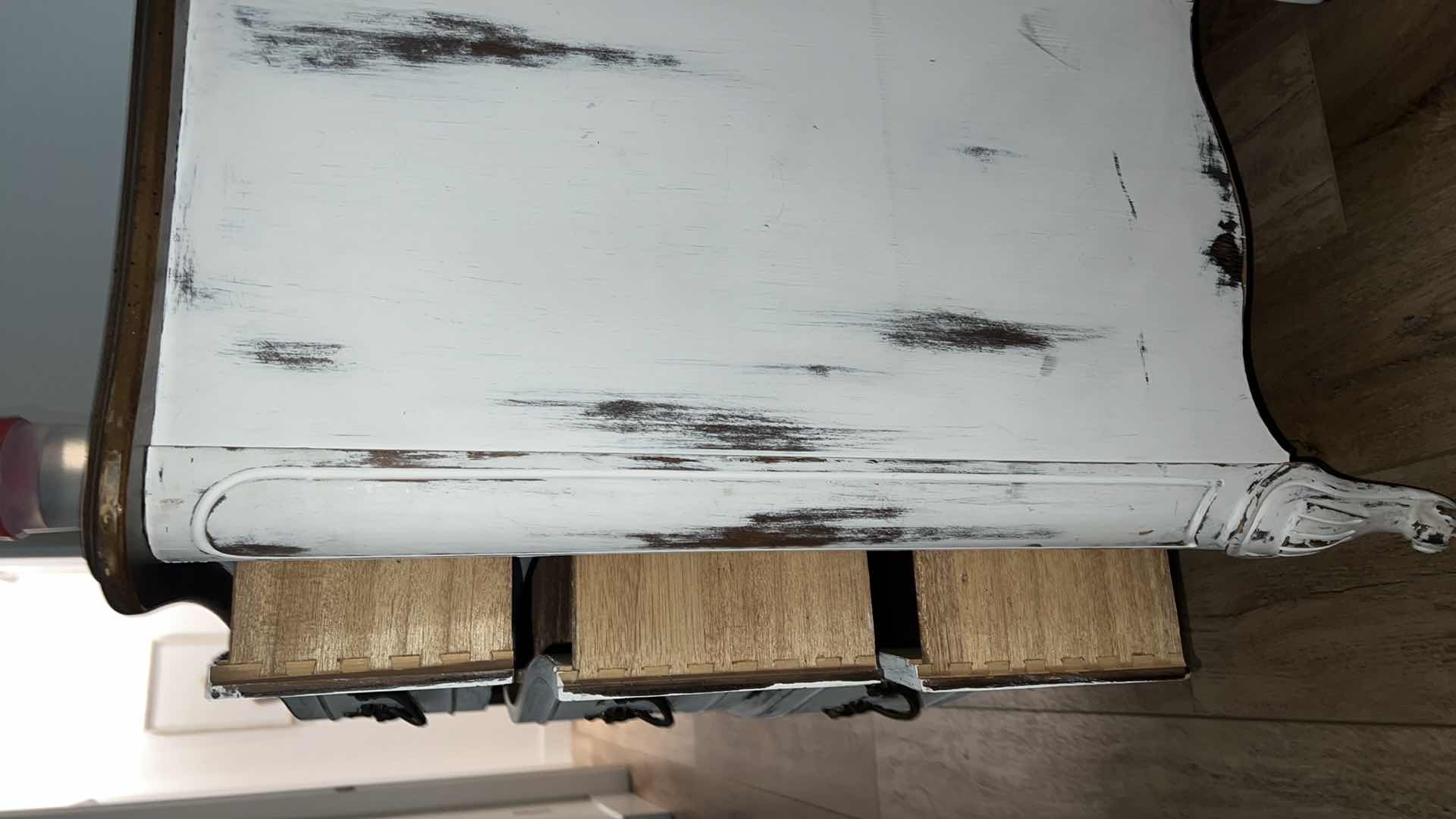 Photo 1 of FURNITURE-WHITE DISTRESSED WOOD DRESSER WITH 9 DRAWERS. 58“ x 20“ x 29“.