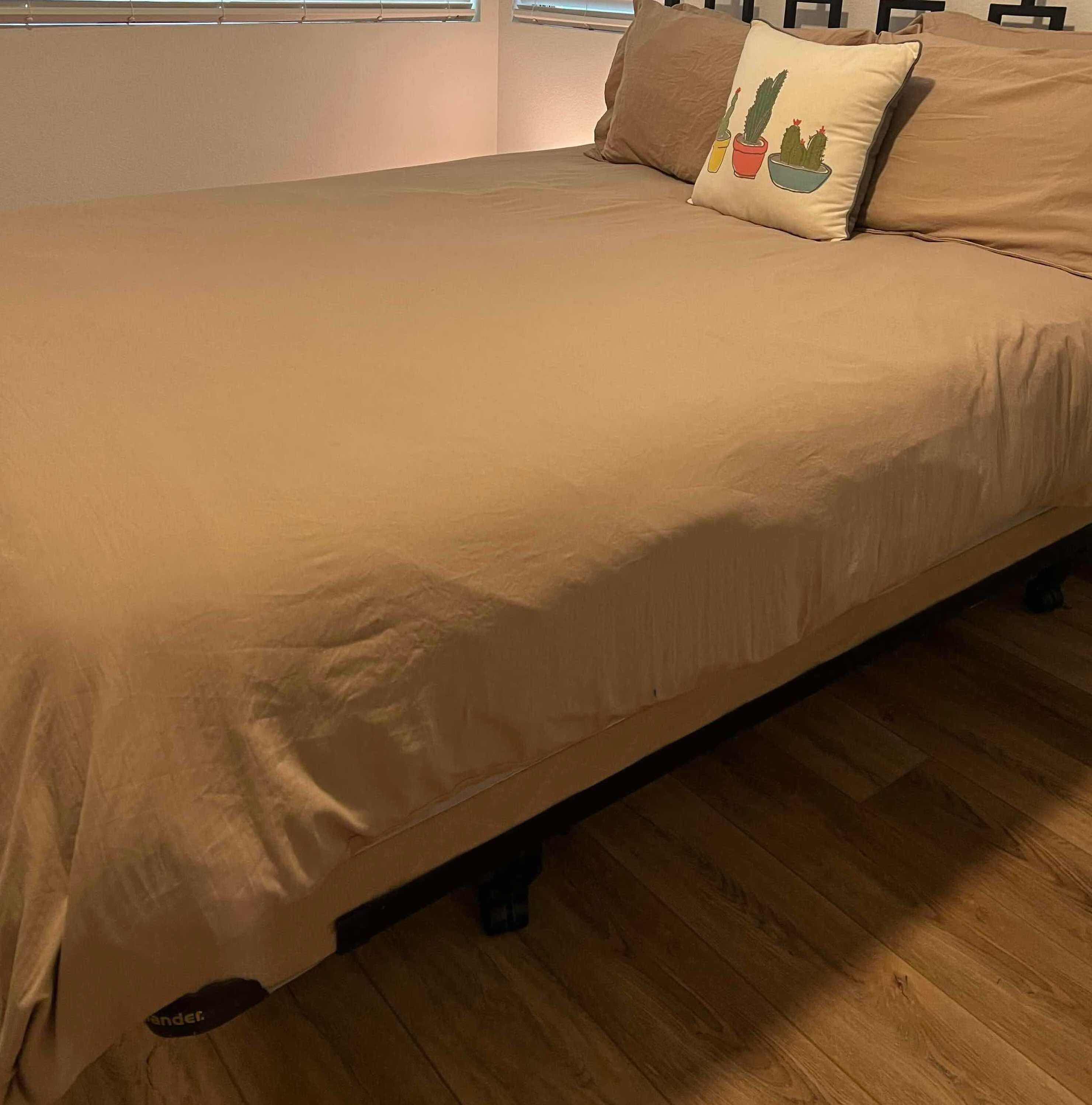 Photo 1 of BEDDING-QUEEN SIZE BEIGE DUVET AND 4 PIECE PILLOW SHAM SET. DECORATIVE CACTUS THROW PILLOW, 7 STANDARD PILLOWS (3 WITH NO PILLOW CASE)