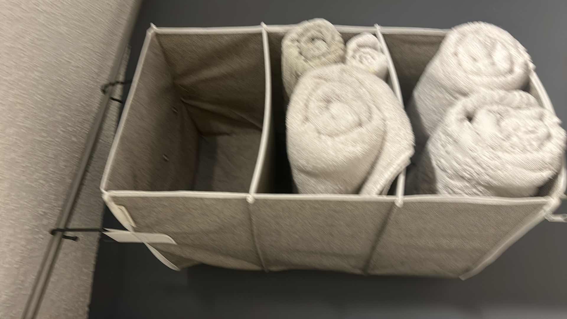 Photo 1 of HANGING STORAGE BASKET WITH POLE AND TOWELS