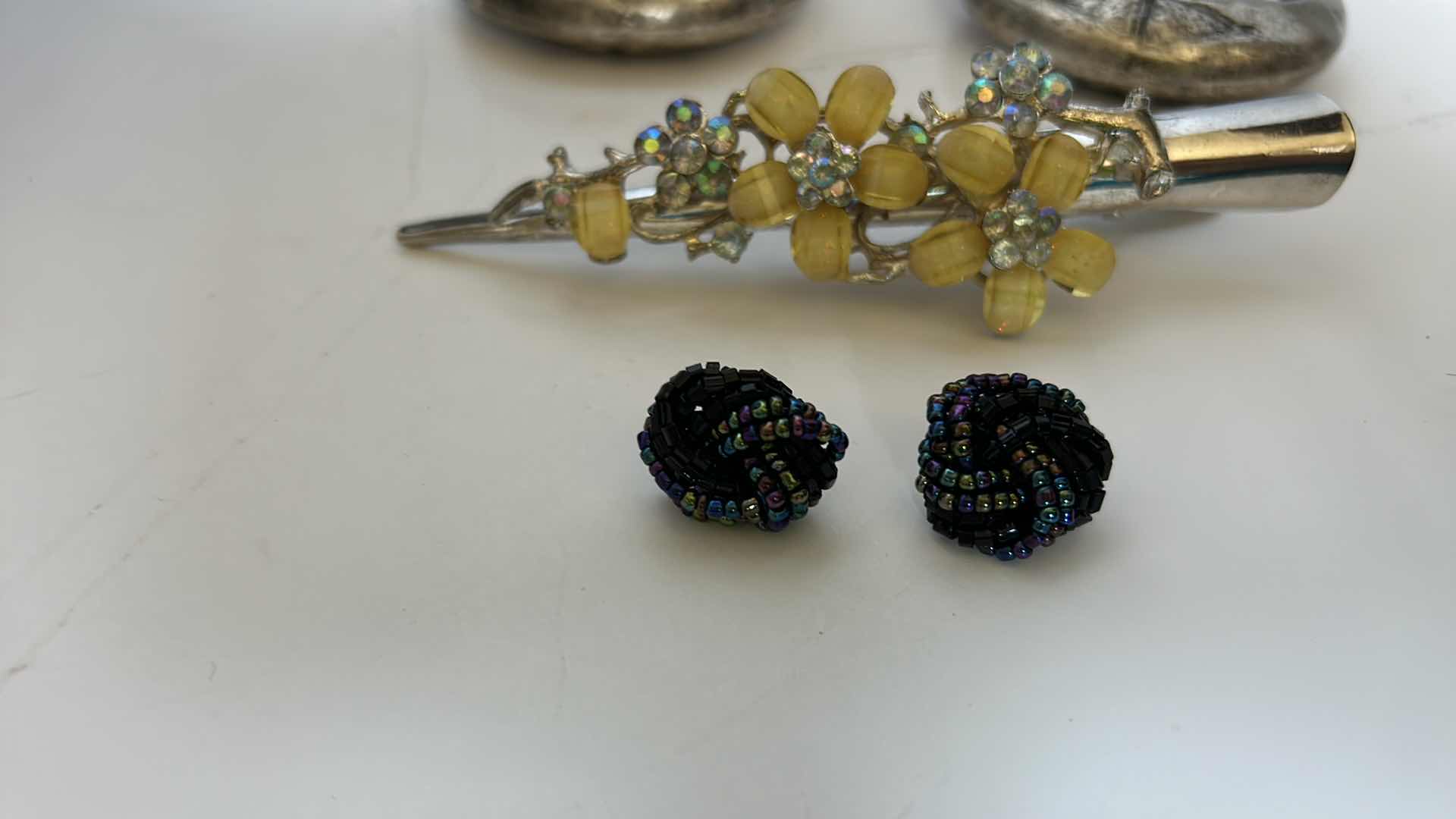 Photo 1 of COSTUME JEWELRY, ONE NECKLACE, TWO PAIRS OF EARRINGS, AND A BARRETTE.