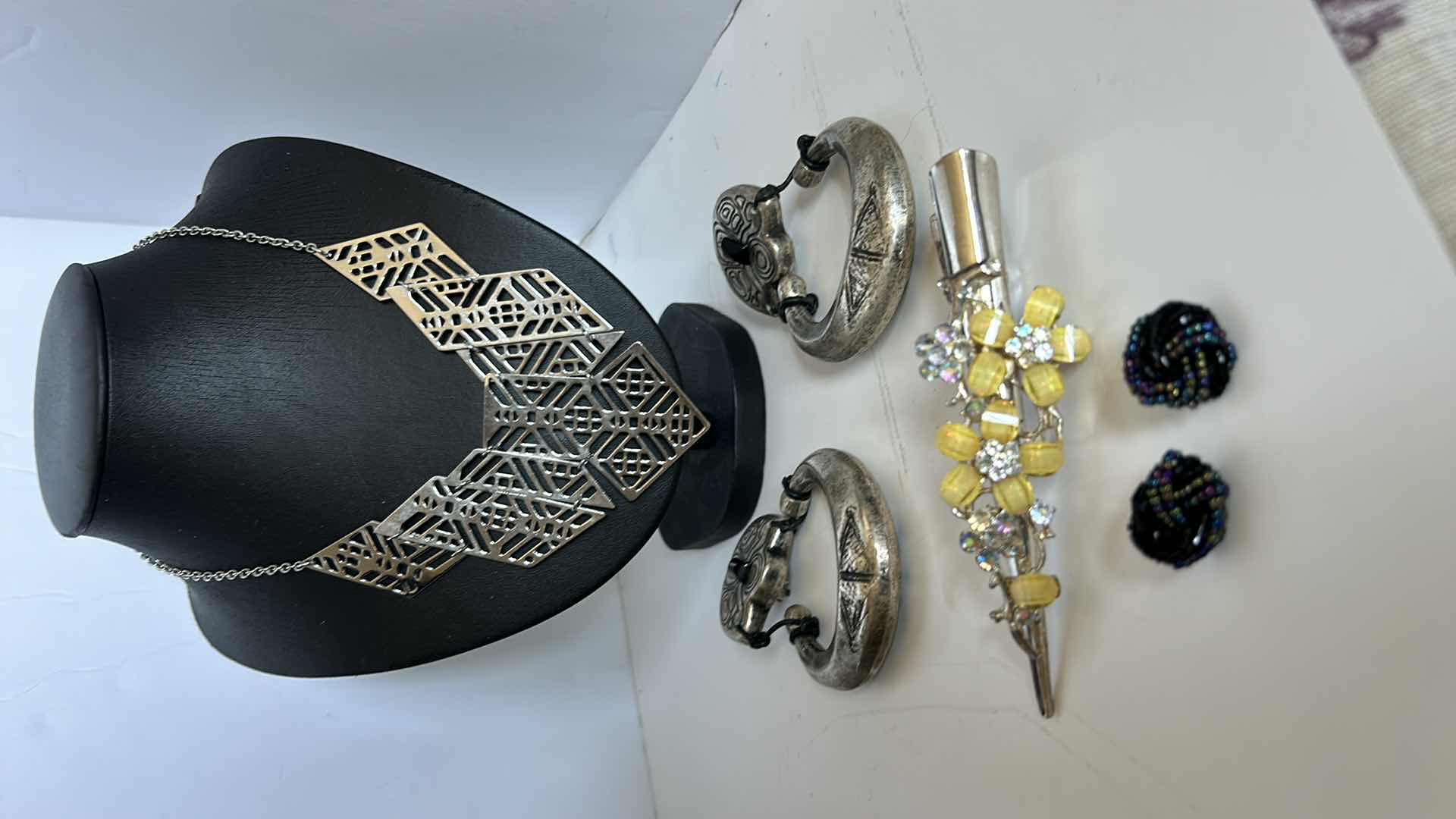 Photo 1 of COSTUME JEWELRY, ONE NECKLACE, TWO PAIRS OF EARRINGS, AND A BARRETTE.