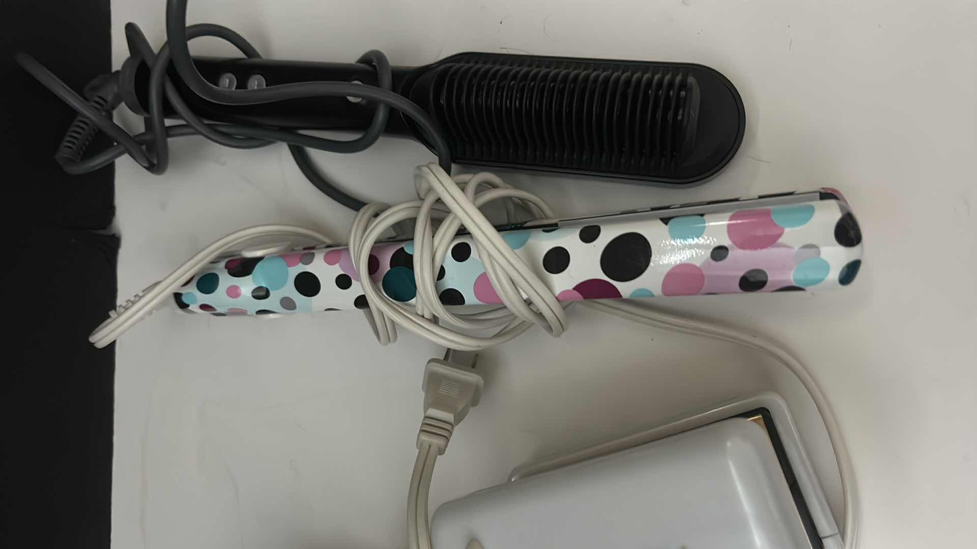 Photo 1 of HAIR STRAIGHTENING TOOLS.