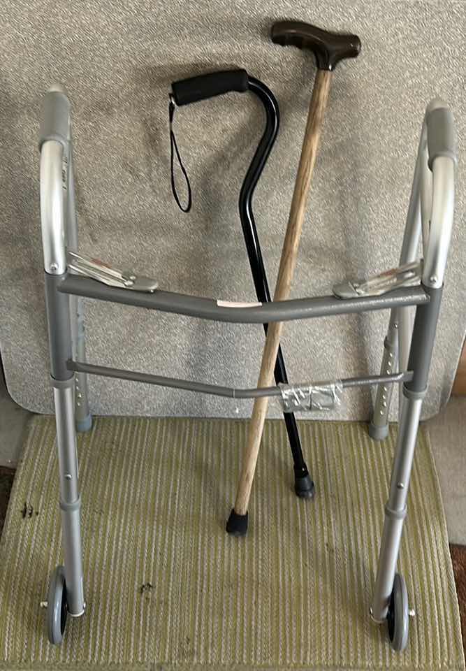 Photo 2 of NEW GUARDIAN 2 BUTTON FOLDING WALKER AND 2 CANES