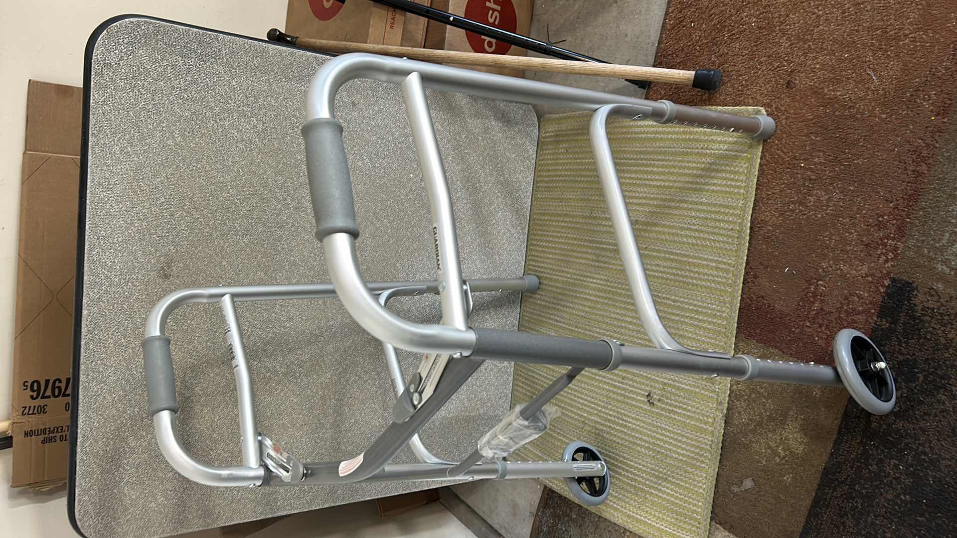 Photo 1 of NEW GUARDIAN 2 BUTTON FOLDING WALKER AND 2 CANES