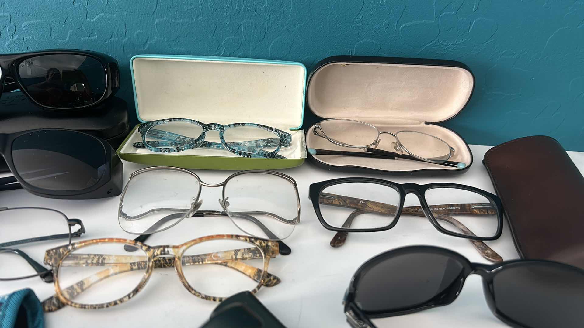 Photo 1 of EYEGLASSES AND SUNGLASSES WITH ASSORTED CASES.