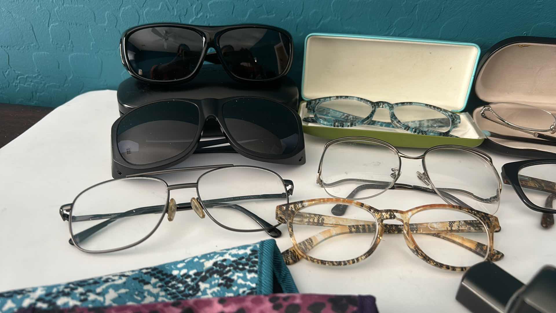 Photo 1 of EYEGLASSES AND SUNGLASSES WITH ASSORTED CASES.