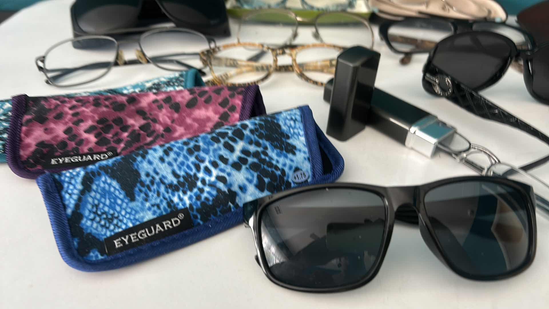 Photo 1 of EYEGLASSES AND SUNGLASSES WITH ASSORTED CASES.