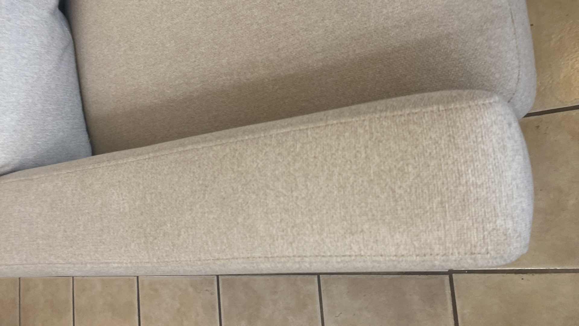 Photo 1 of 7’ OATMEAL COLOR FABRIC SODA WITH WOOD LEGS 3 TOSS PILLOWS(2 available each sold separately)