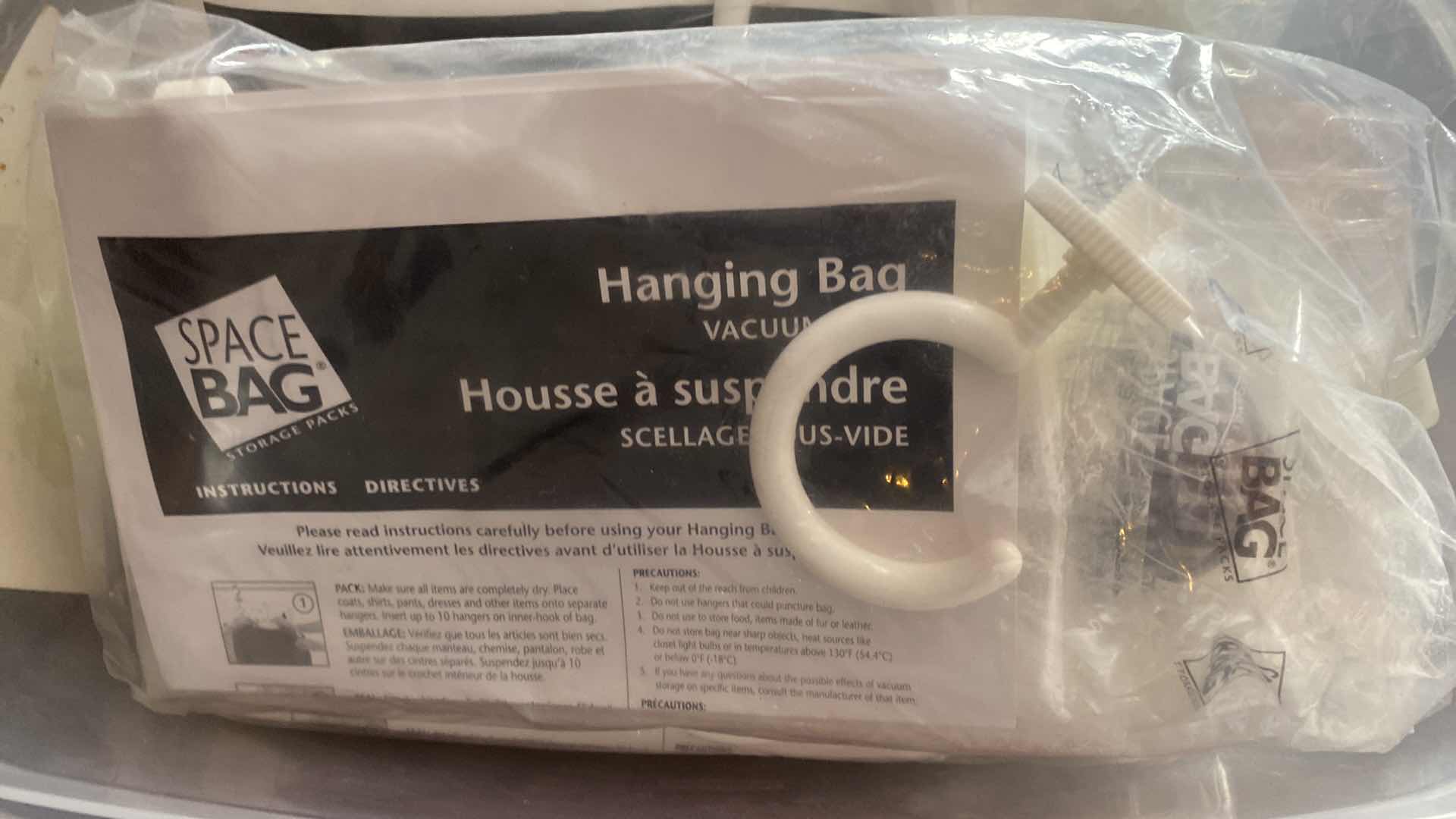 Photo 1 of 3 SPACE BAG HANGING BAGS IN RUBBERMAID CONTAINER WITH LID