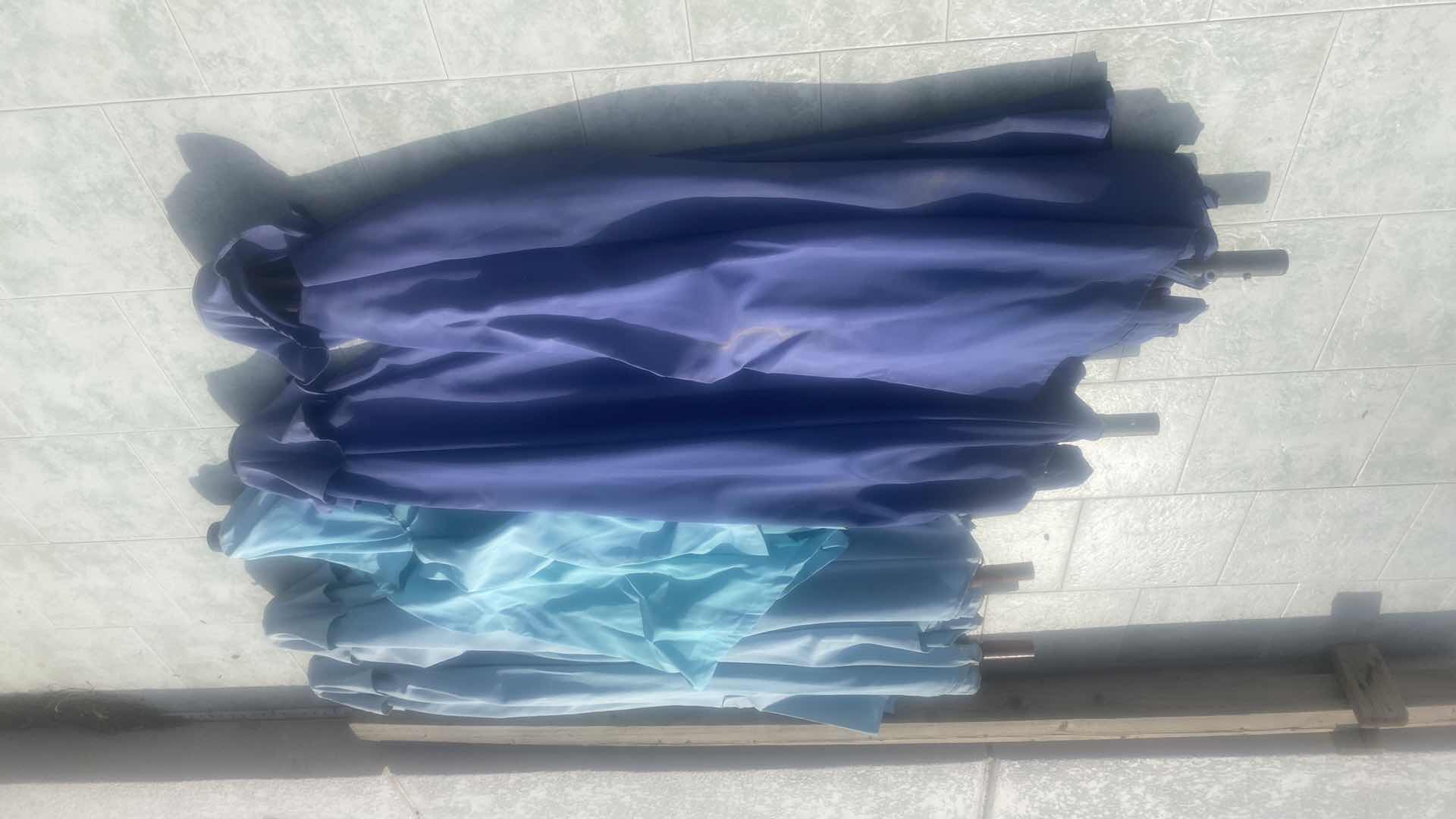 Photo 2 of 11 BLUE OUTDOOR UMBRELLAS - some bottom poles missing
