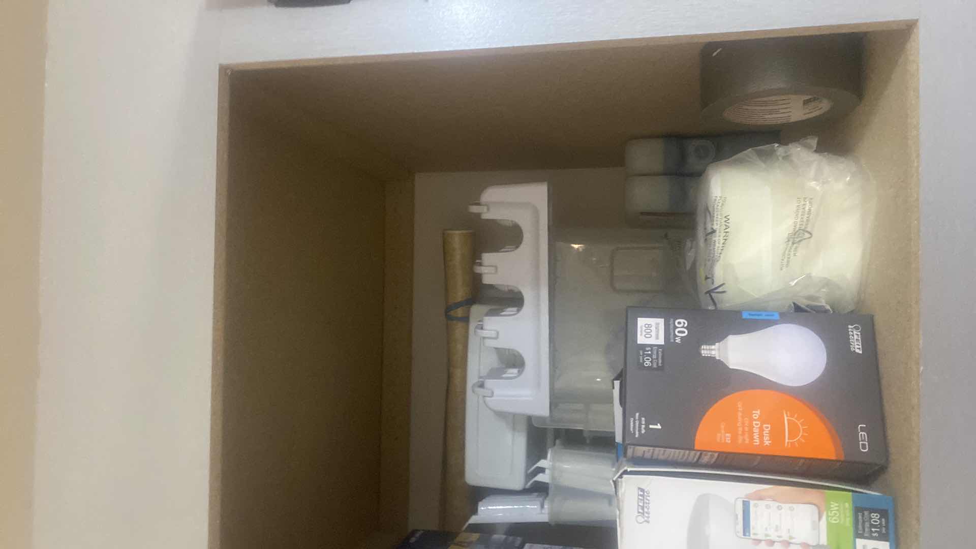 Photo 1 of CONTENTS OF CABINET - LIGHT BULBS