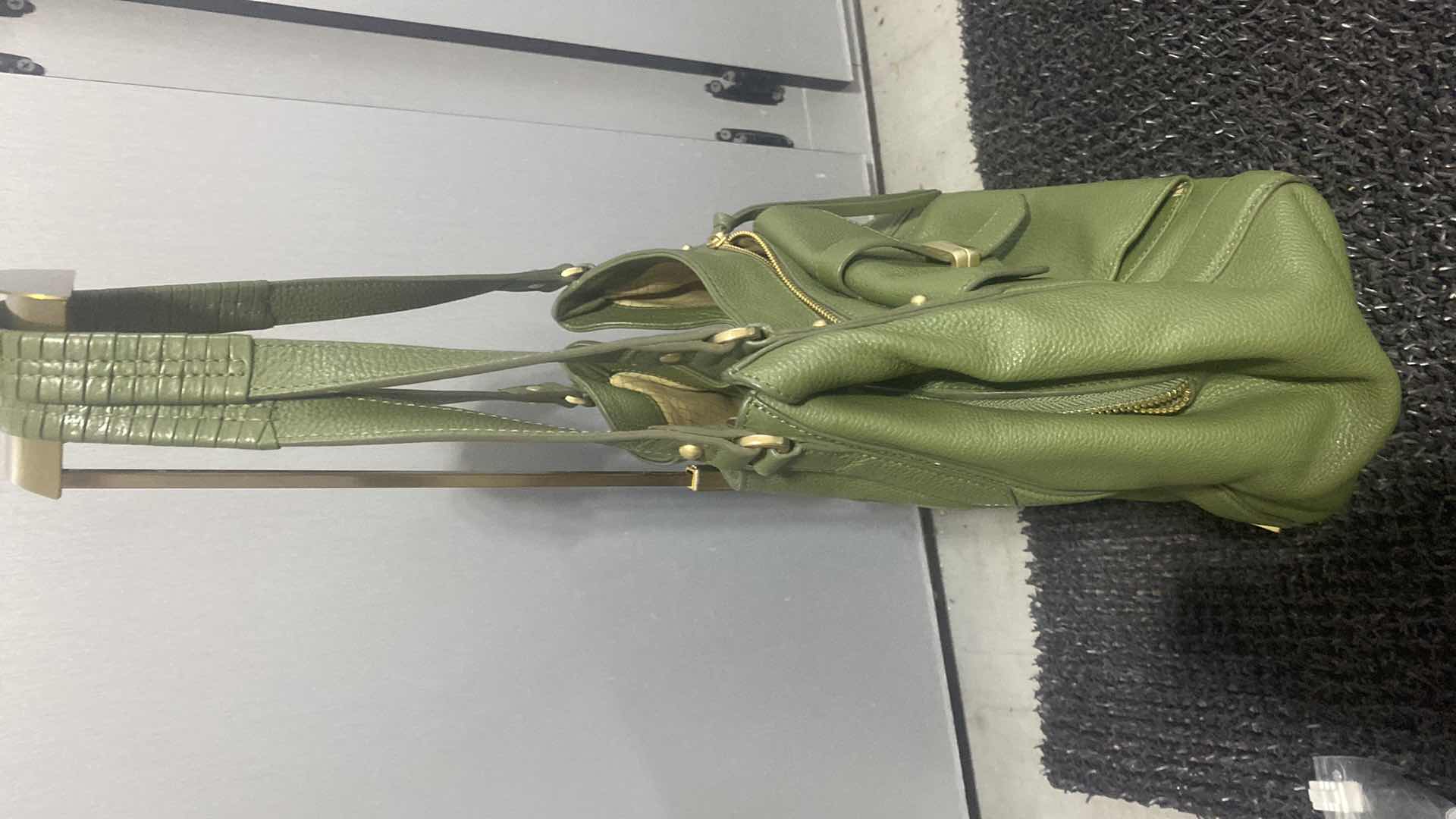 Photo 1 of $100 LODIS MADISON FRONT POCKET HANDBAG - GREEN