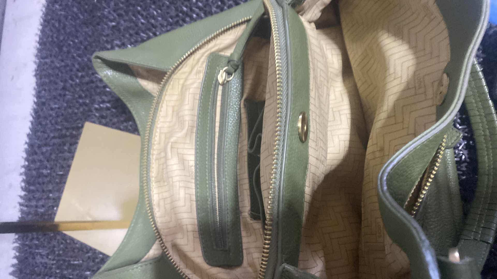 Photo 1 of $100 LODIS MADISON FRONT POCKET HANDBAG - GREEN